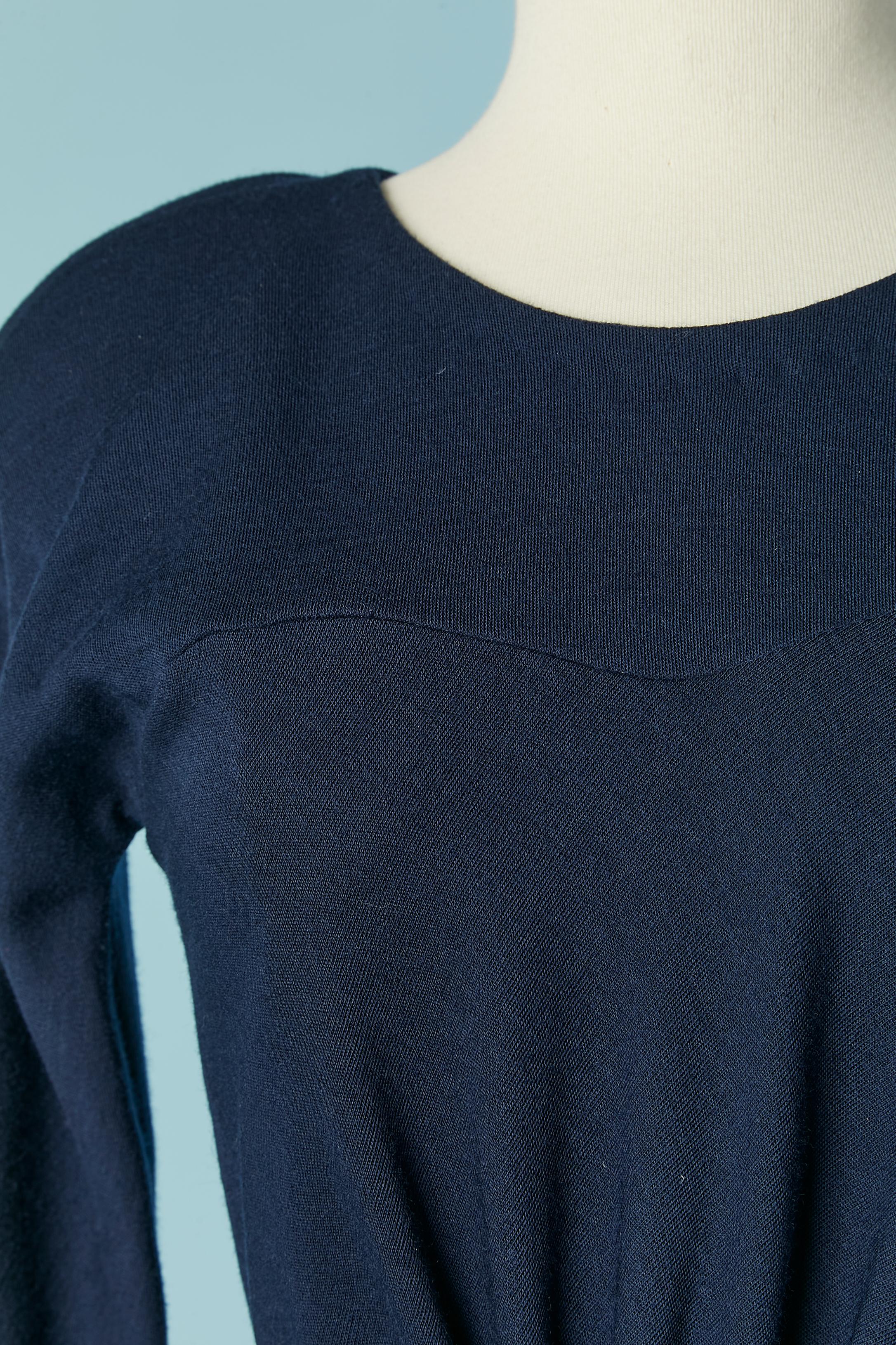 Navy blue wool jersey dress with satin belt ribbon. Shoulder-pad. Gather on the waist with elastic band. Zip closure on the middle back + hook&eye 
SIZE 8 (US) but fit S (small waist) 