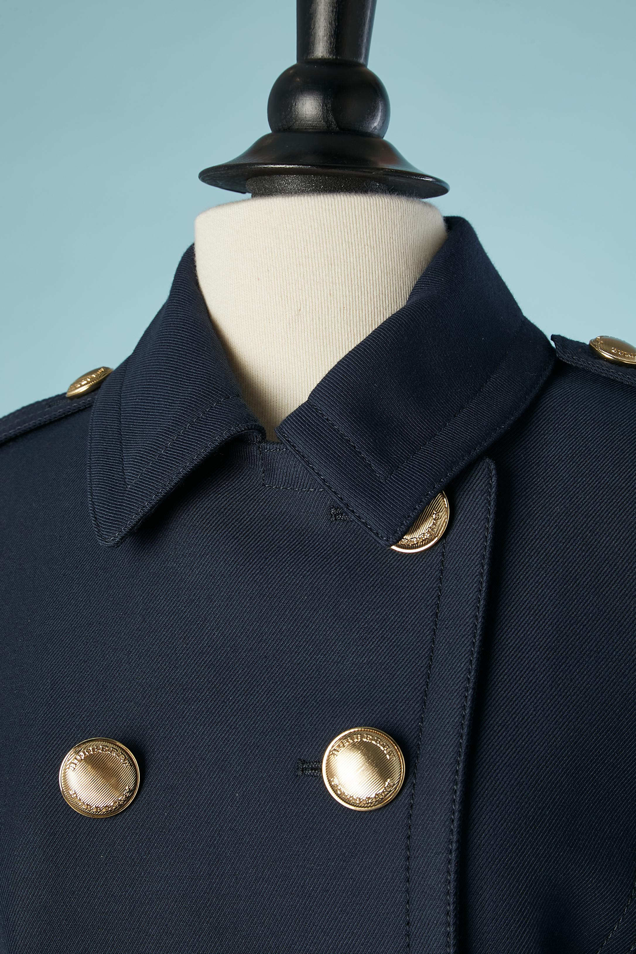 Navy blue wool officer double-breasted  jacket and gold metal branded button.Fabric composition: 15% polyester, 43% wool, 42% cotton.
Check lining: cotton & acetate. Sleeve lining: 100% rayon.
SIZE 6US/ 8 UK/ 40 IT