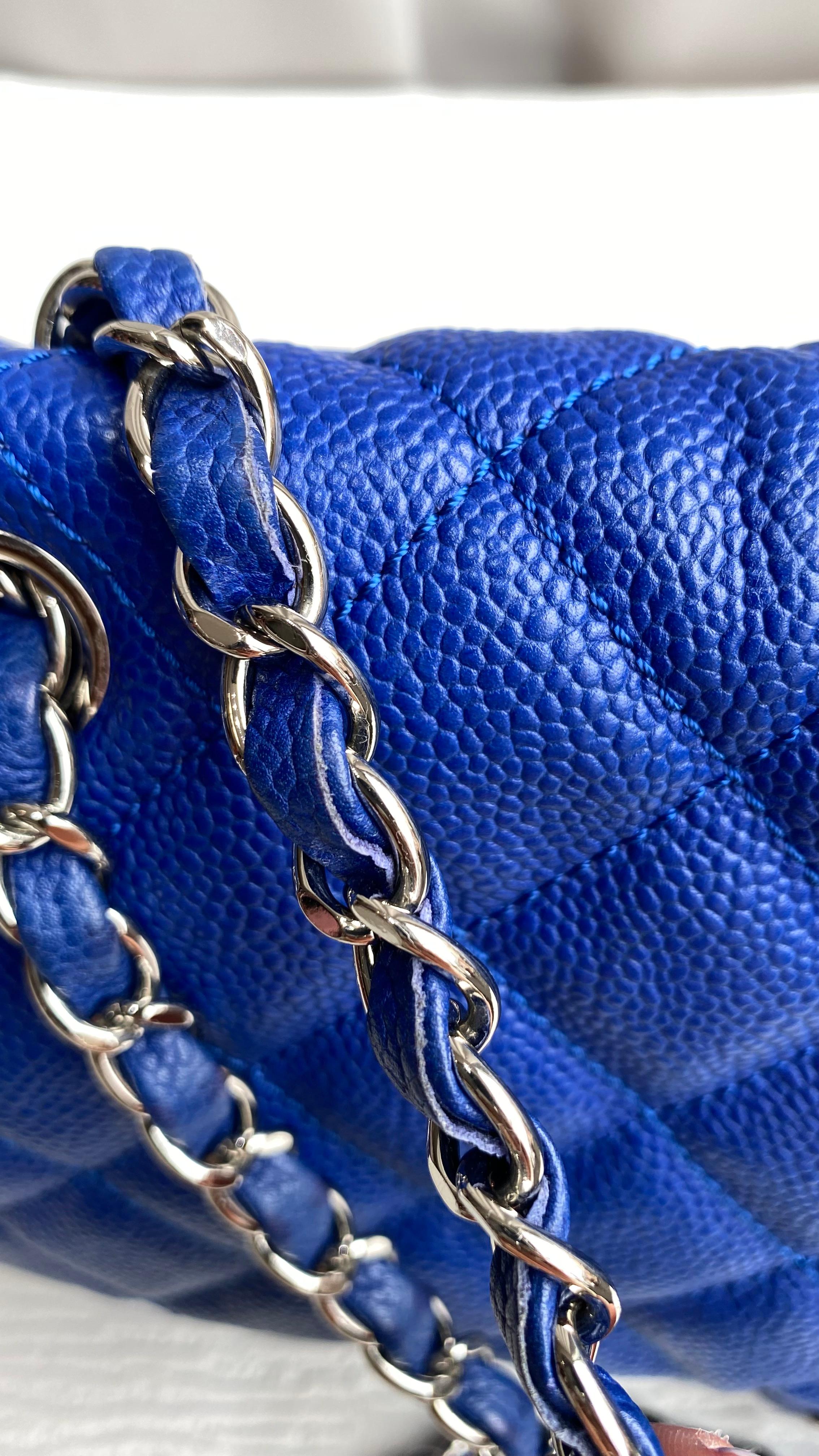 This Chanel Navy Chanel Quilted Jumbo Bag is a classic and timeless piece that is sure to add a touch of luxury to any outfit. It is made from high-quality navy blue caviar leather and features a beautiful quilted design. The bag is in great