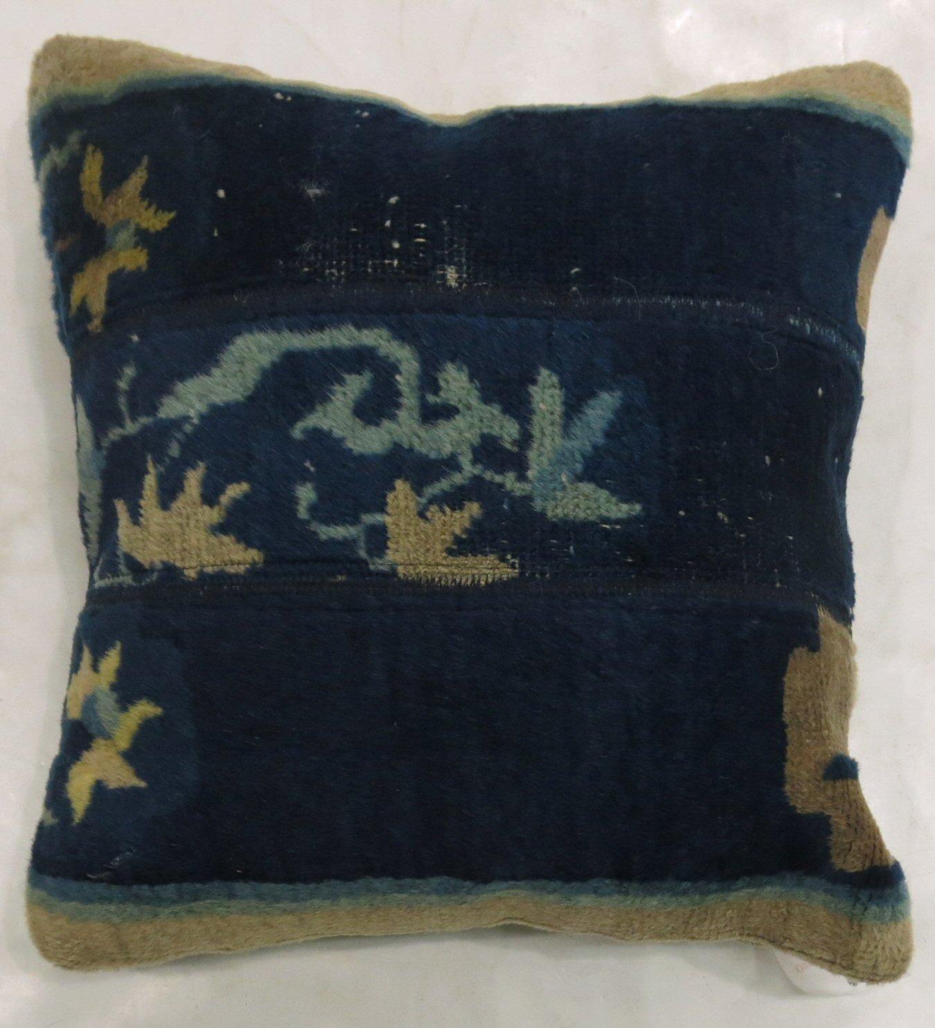 Pillow made from a 20th century Chinese rug with zipper closure and poly-fill.

Measures: 16'' x 16''.