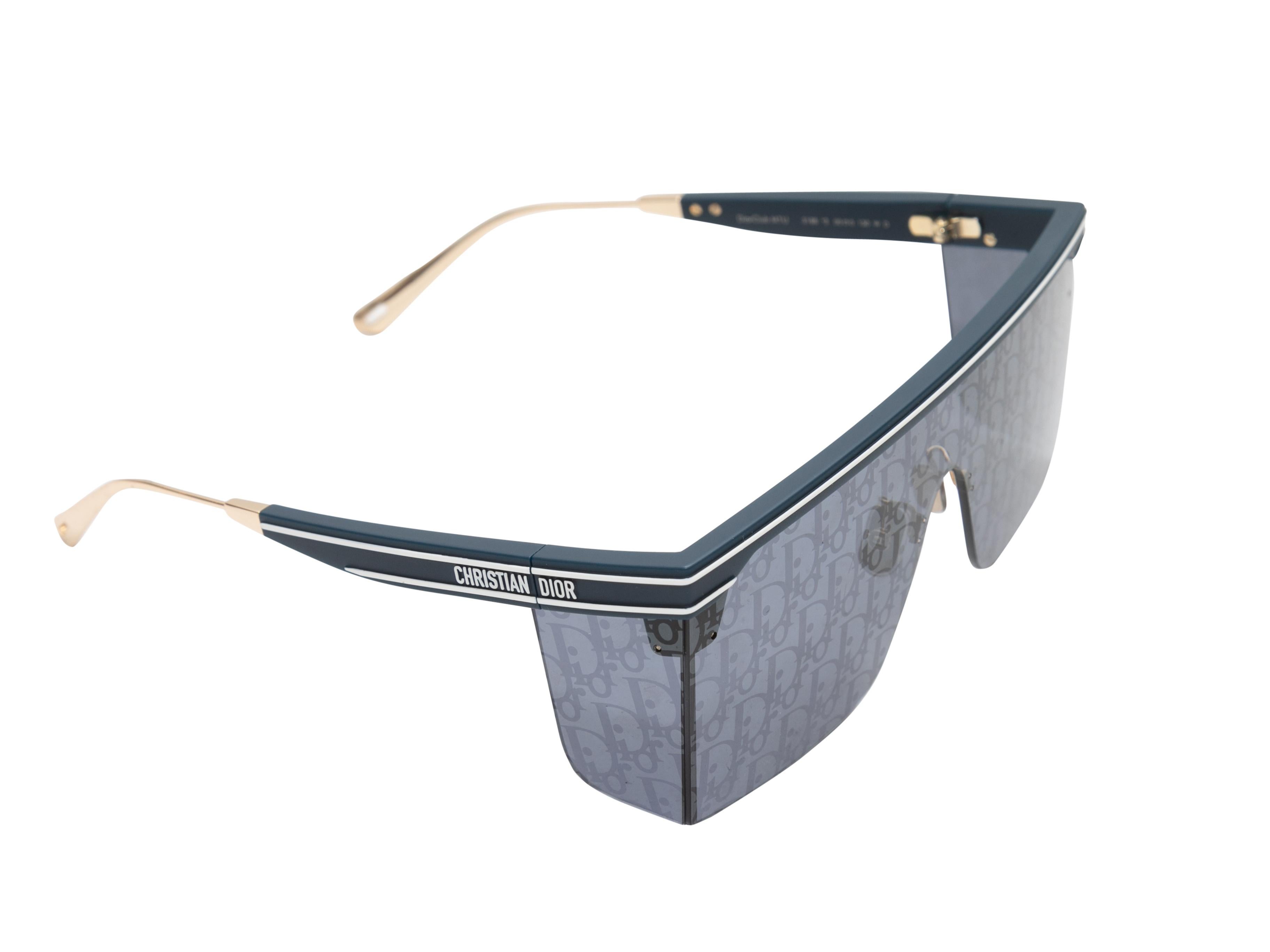 Navy acetate logo shield sunglasses by Christian Dior. Gold-tone metal detailing at arms. 5.5