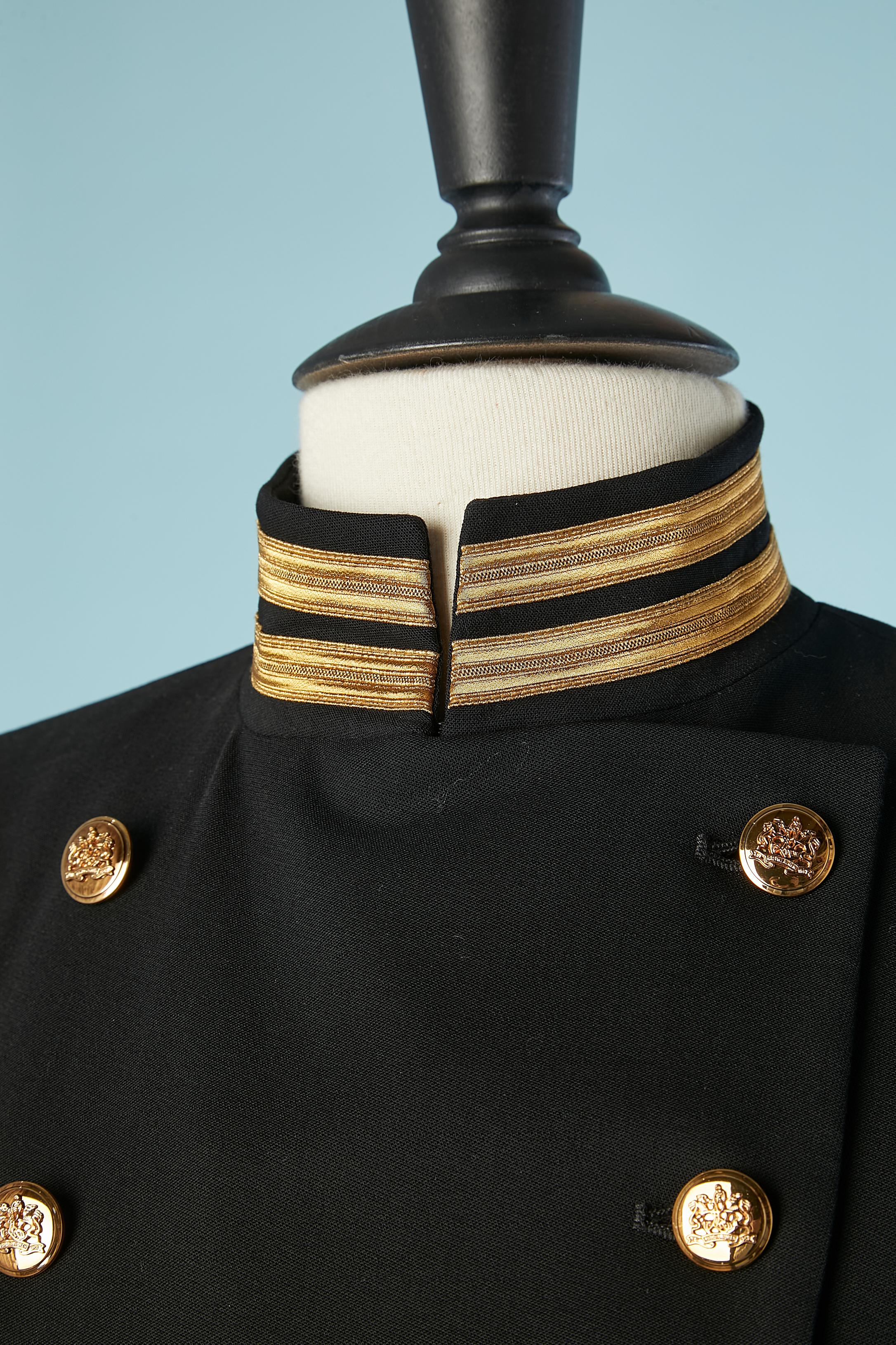Navy double-breasted officier style jacket. 
Main fabric composition: 98% wool, 2% elastan. Lining: 93% silk, 7% elastane. 
Shoulder-pad. 
SIZE 4 (Us) 34 (Fr) XS 