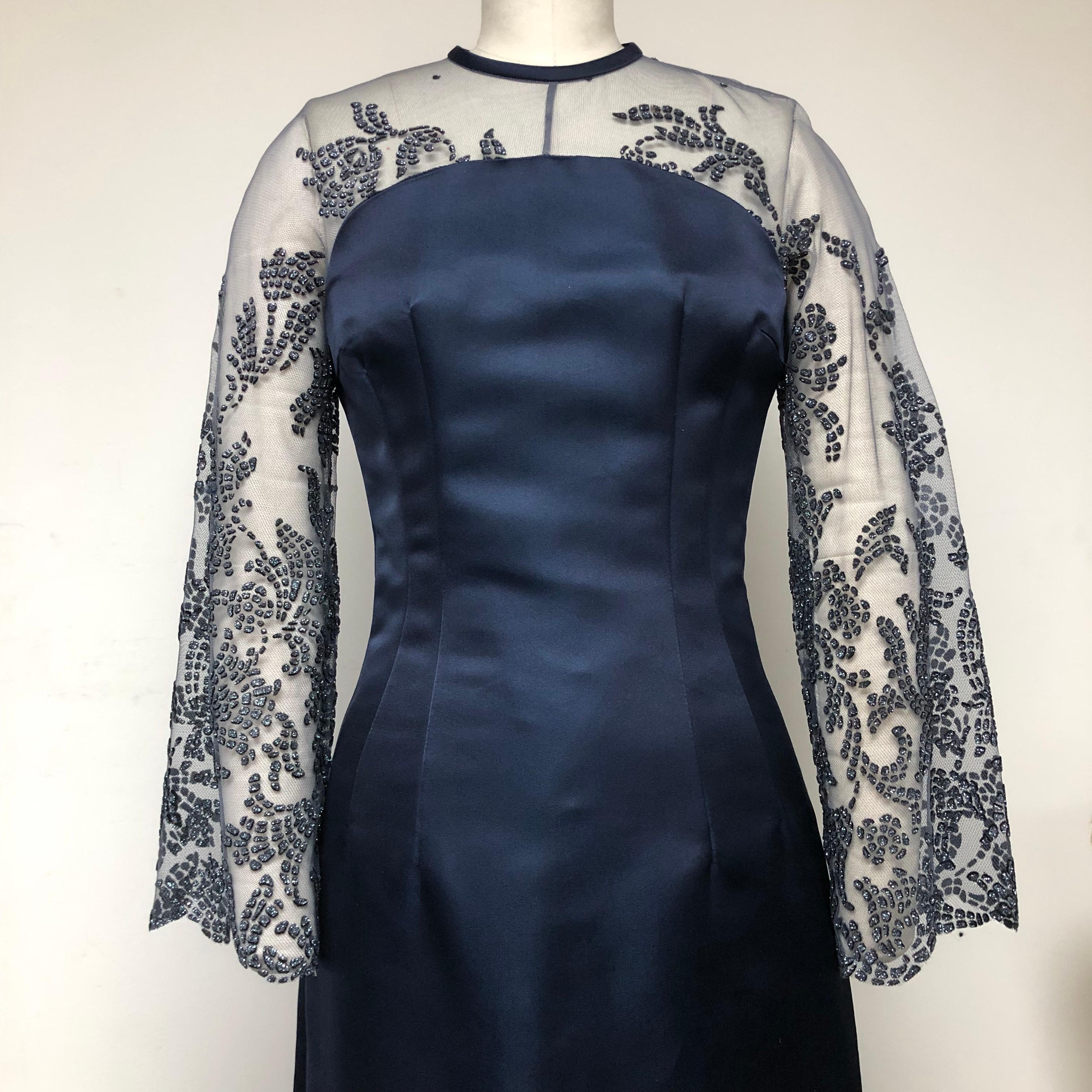 Unparallelled classic elegance! Forever! 100% Taroni navy silk gown in luxurious double faced satin with upper bodice and sleeve in embellished tulle. Double darts emphasize the waist, which gives a shapely fit. Perfect for black tie occasions and