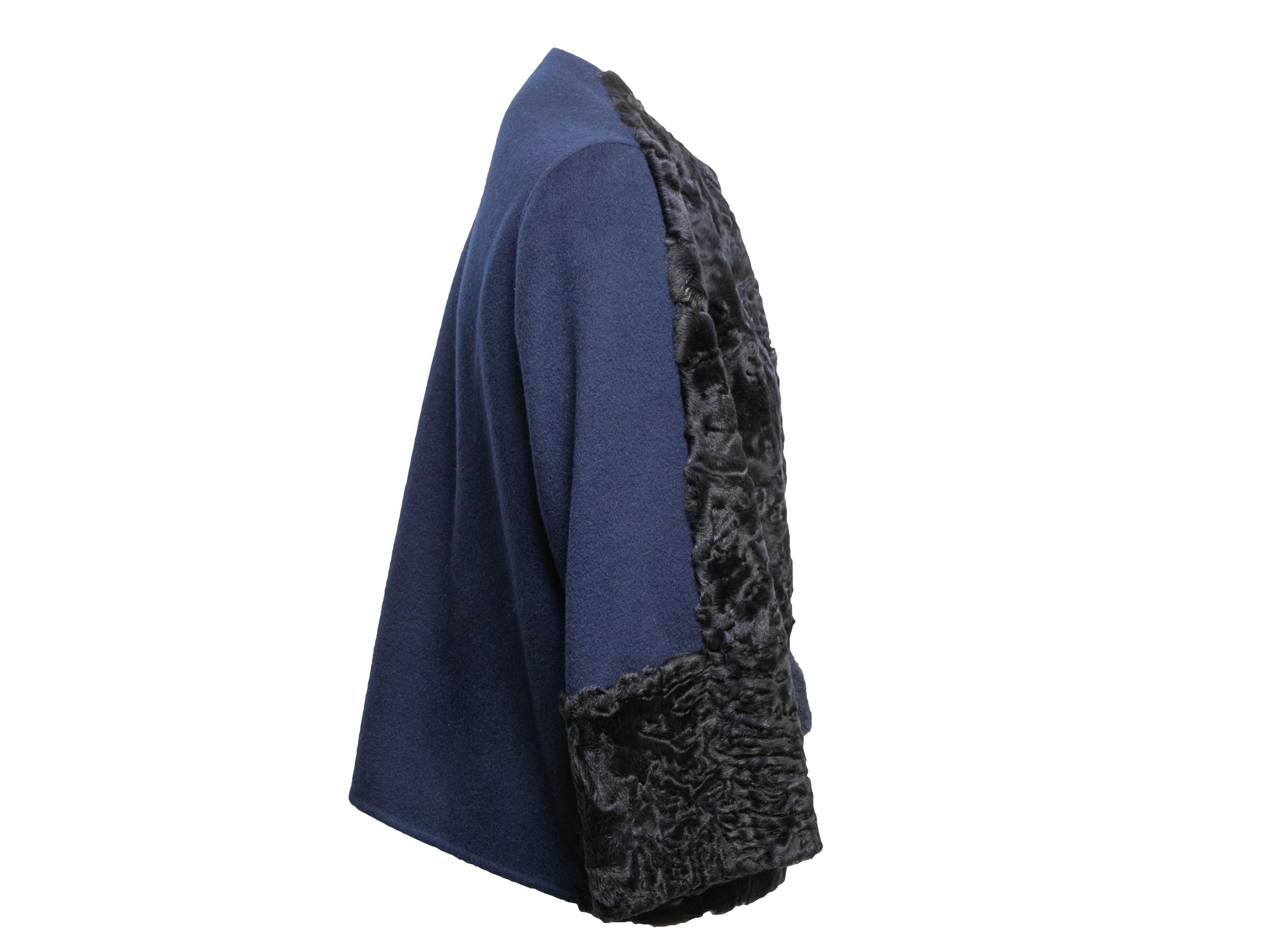 Product Details: Navy cashmere, Persian lamb fur, and mink fur jacket by Lafayette 148. Crew neck. Dual flap pockets at hips. 44