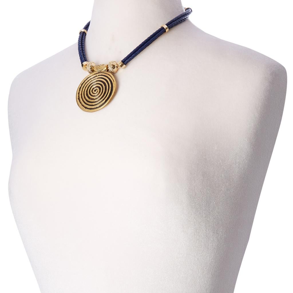 Four strands of braided navy leather, bound together with perfectly placed gold accents, featuring our signature 14K plated yellow gold magnetic clasp. 

This necklace is beautiful on its own, or enhanced by adding one of our Clara Williams