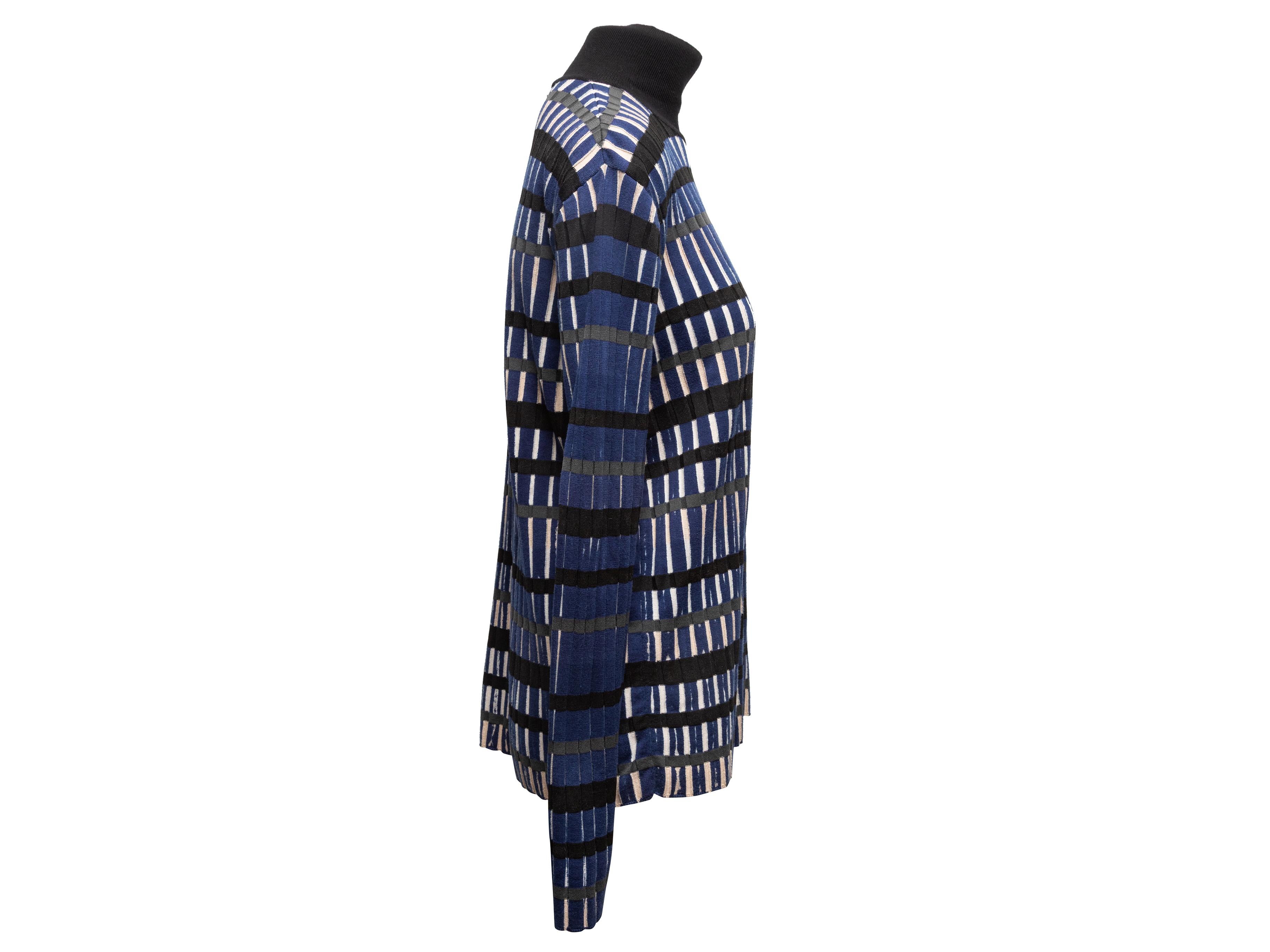 Navy, white, and black geometric print turtleneck sweater by Balenciaga. 39