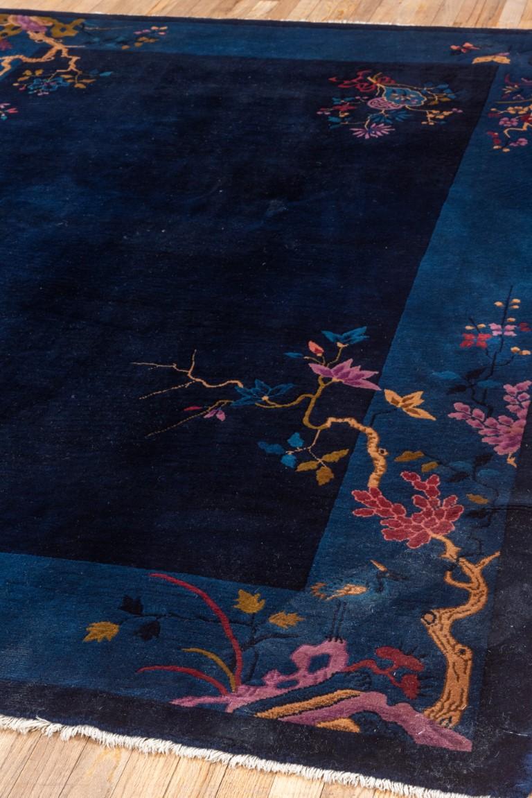 Hand-Knotted Navy Open Field Antique Chinese Rug with Contrasting Light Colors For Sale