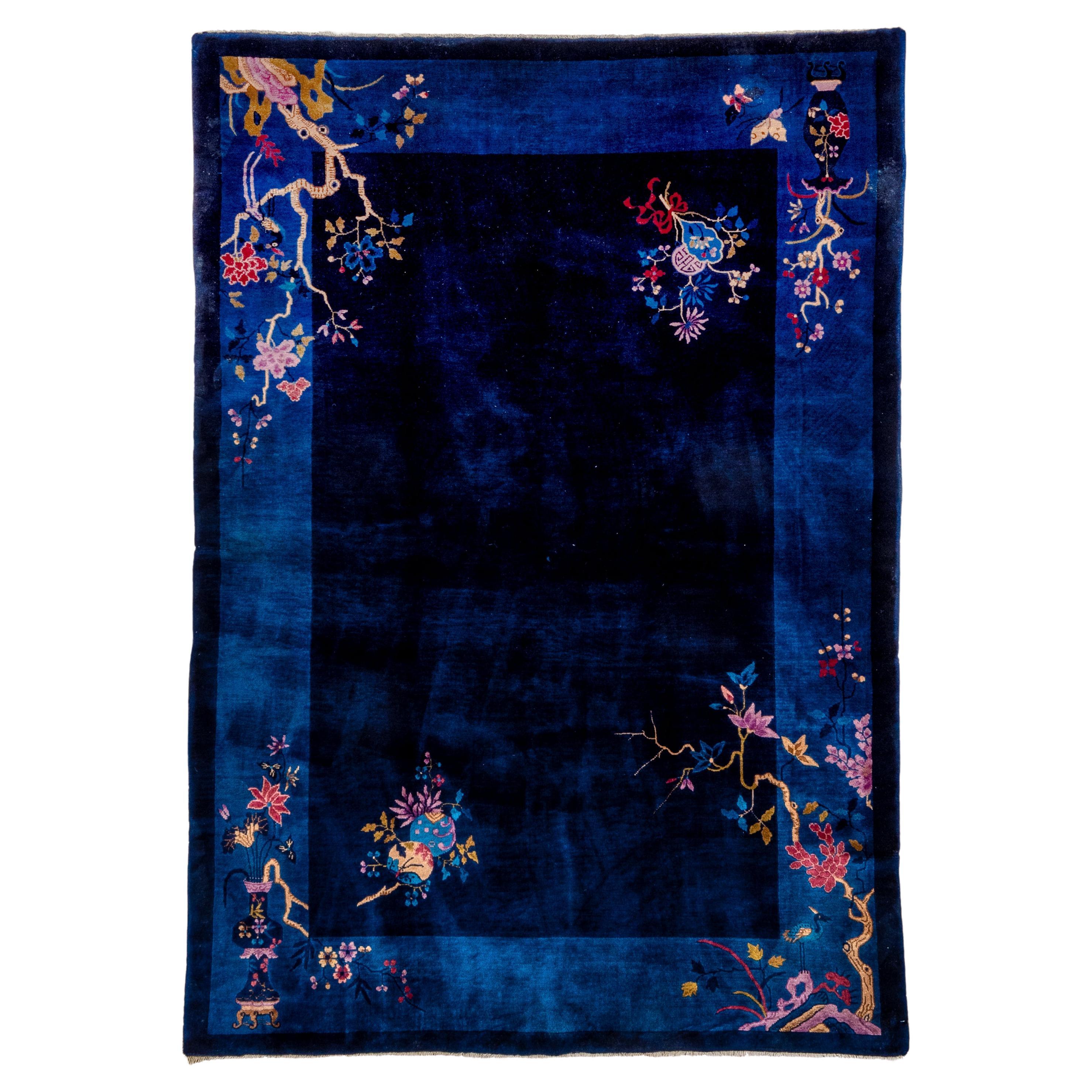 Navy Open Field Antique Chinese Rug with Contrasting Light Colors For Sale