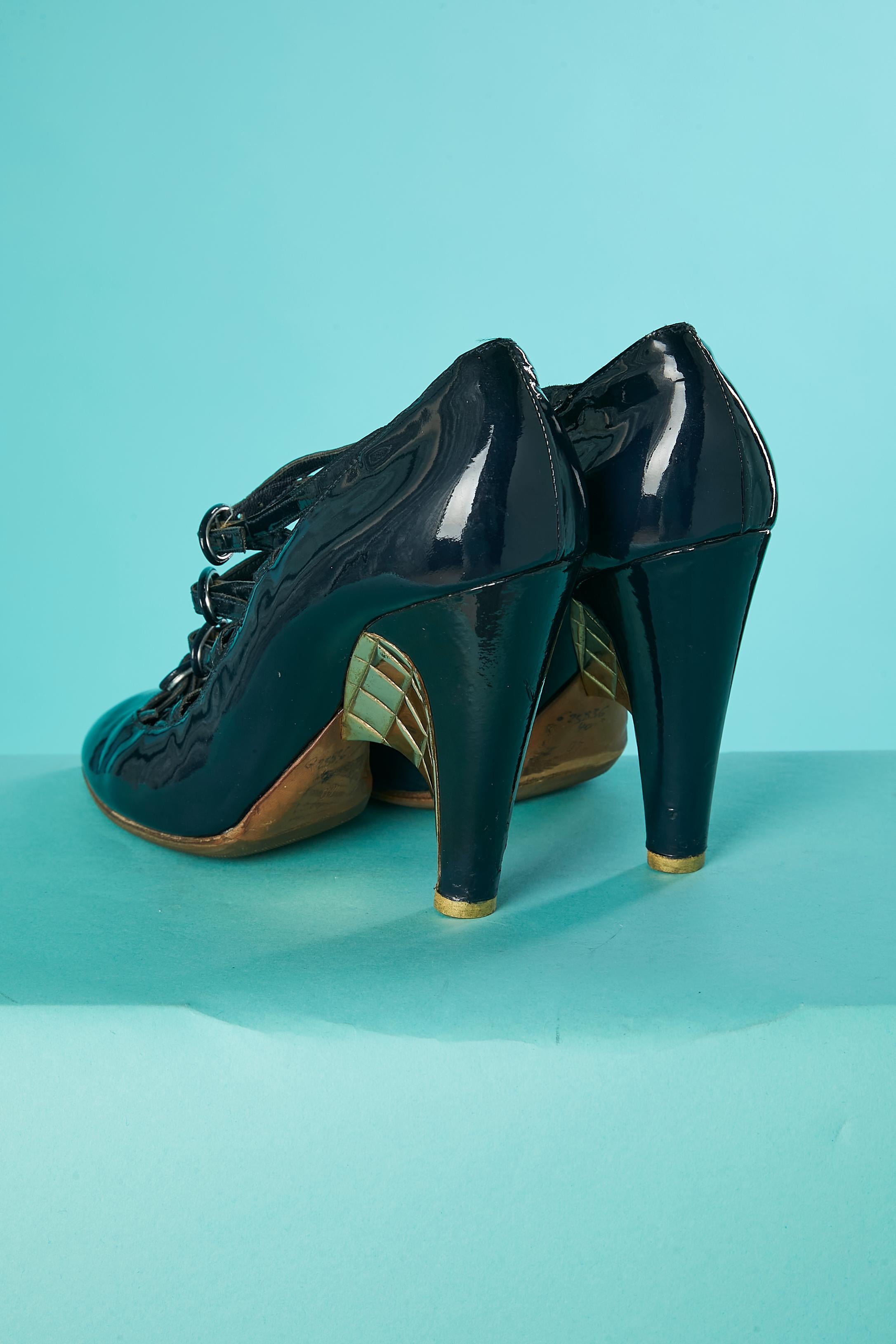 Black Navy patent leather pump with multi-buckles and gold metal heels Chanel  For Sale