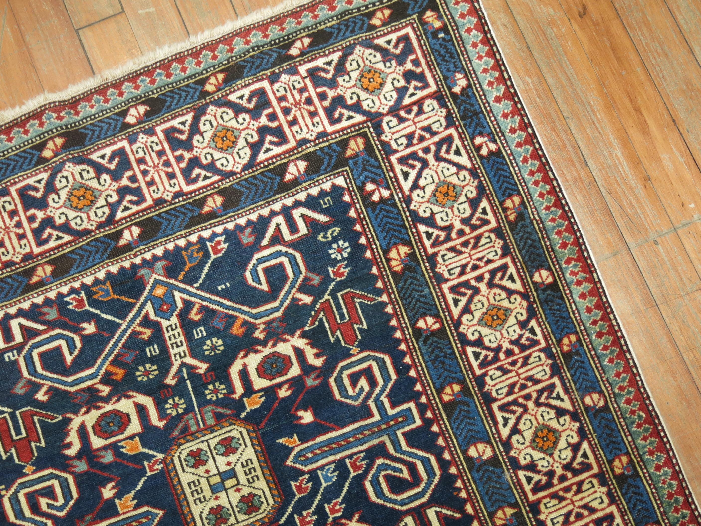 An authentic blue antique Caucasian perdedil rug from the late 19th century, 

Measures: 3' x 4'11