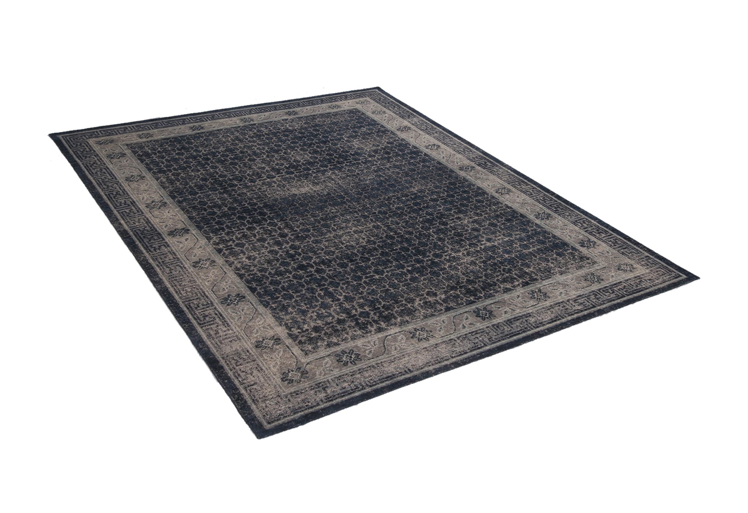 This contemporary hand knotted wool Khotan rug hails from Rug & Kilim’s Homage Collection, enjoying a finer take on distressed shabby chic aesthetic with fewer knots per square inch. The very Industrial navy and smoke blue colorways complement a