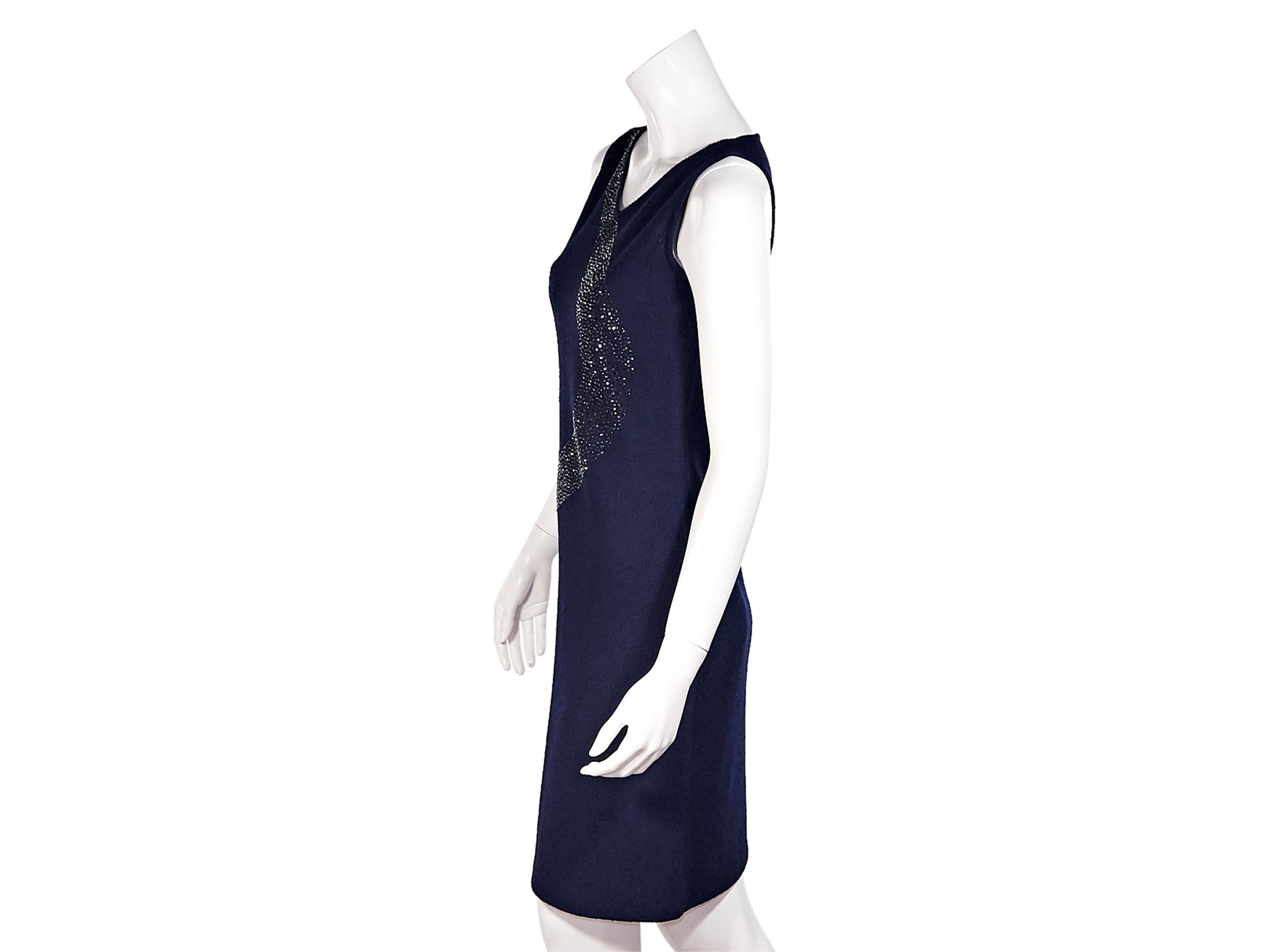 Product details:  Navy crystal embellished bouclé knee-length dress by St. John. V-neck. Sleeveless. Concealed back zip closure. Style yours with a tweed cropped jacket. 34