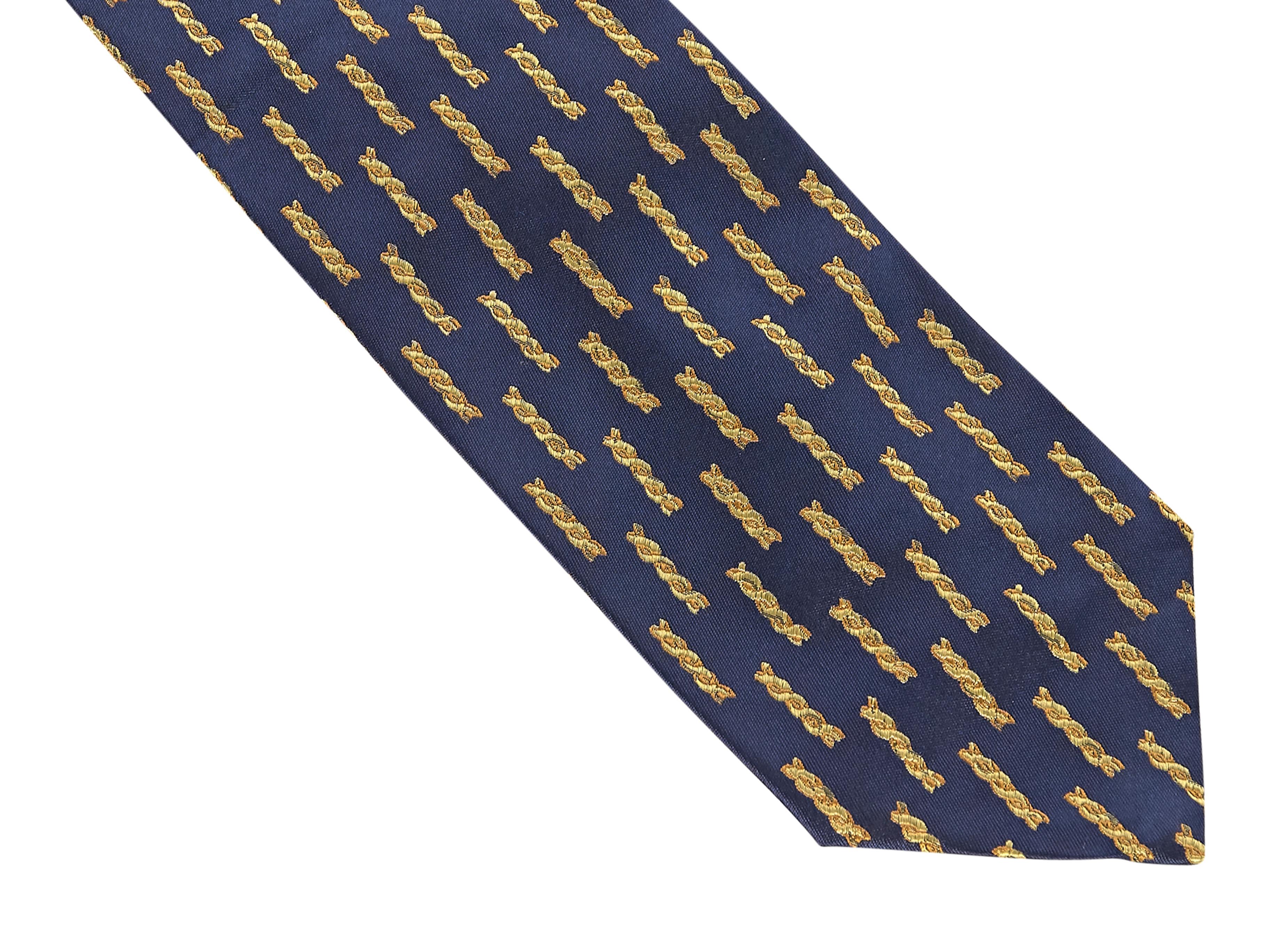 Product details:  Navy with gold chain-pattern silk tie by Gianni Versace. Self-tie. Wear as a belt around a cinched waist silk dress. 58.5
