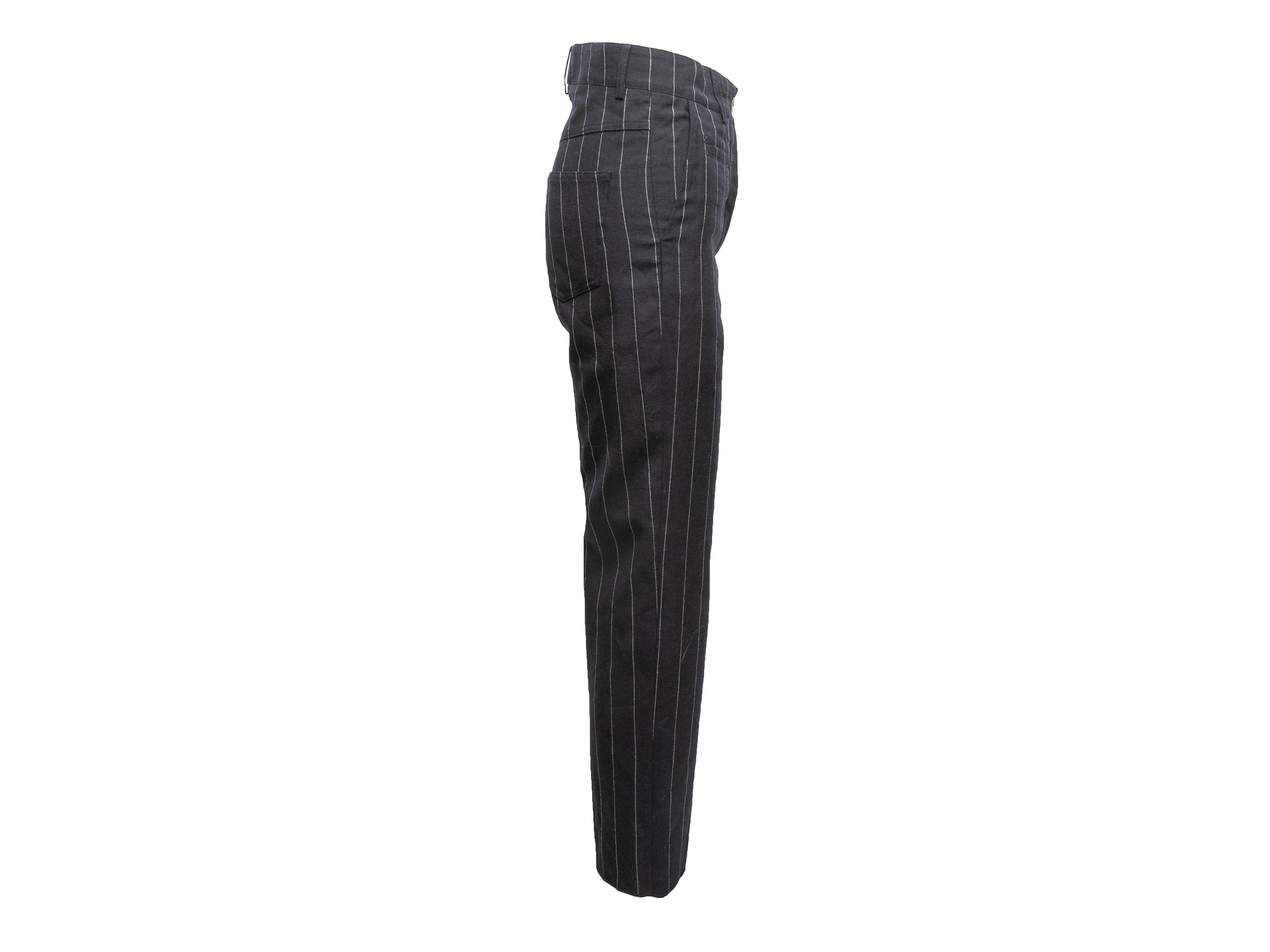 Navy and white wool pinstriped straight-leg pants by Loewe. Four pockets. Front zip and button closures. 29