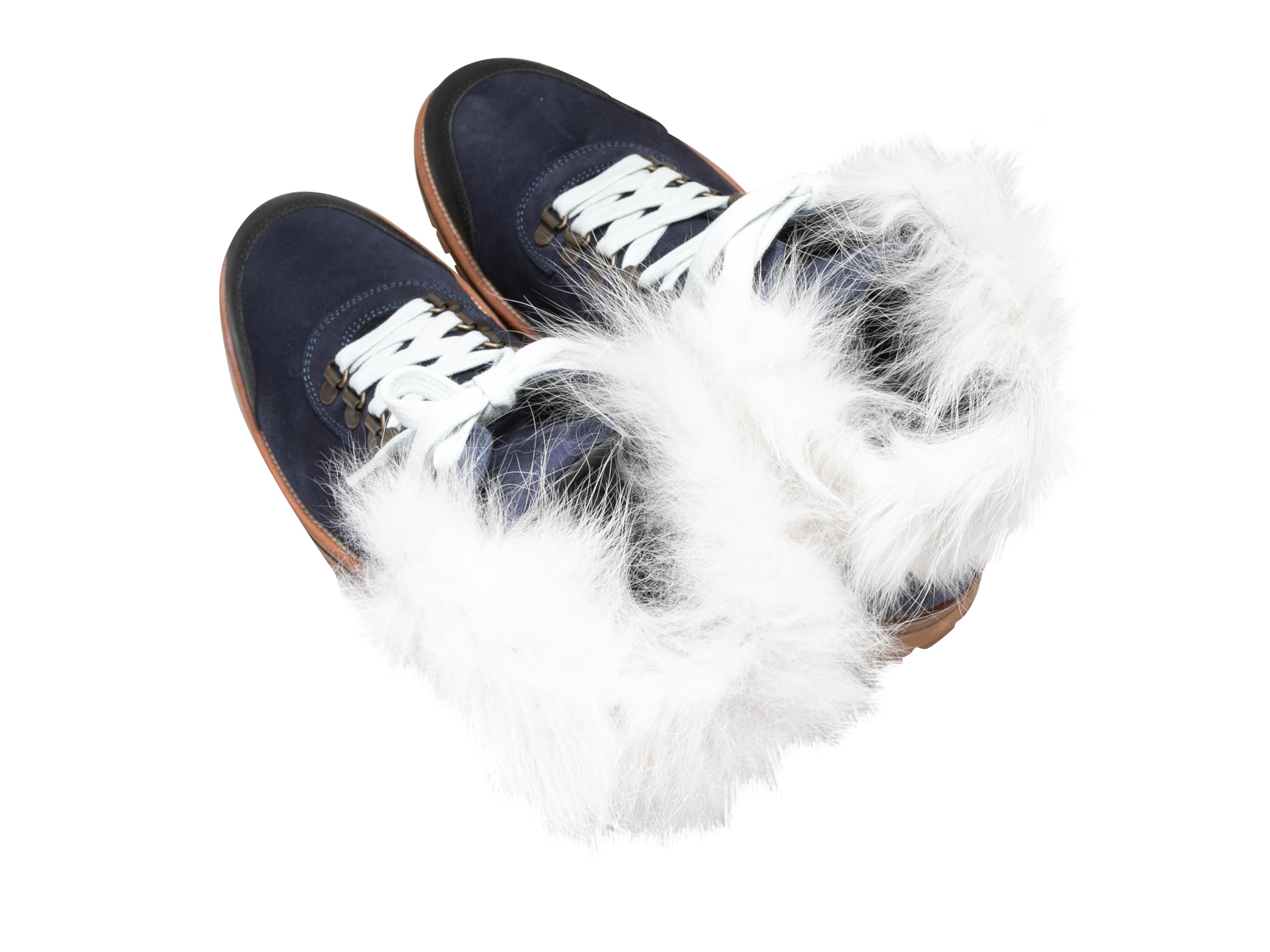 Navy suede lace-up hiking boots by Mr & Mrs Italy. White fur trim at tops. Lug soles. Lace-up tie closures at tops. 5.5