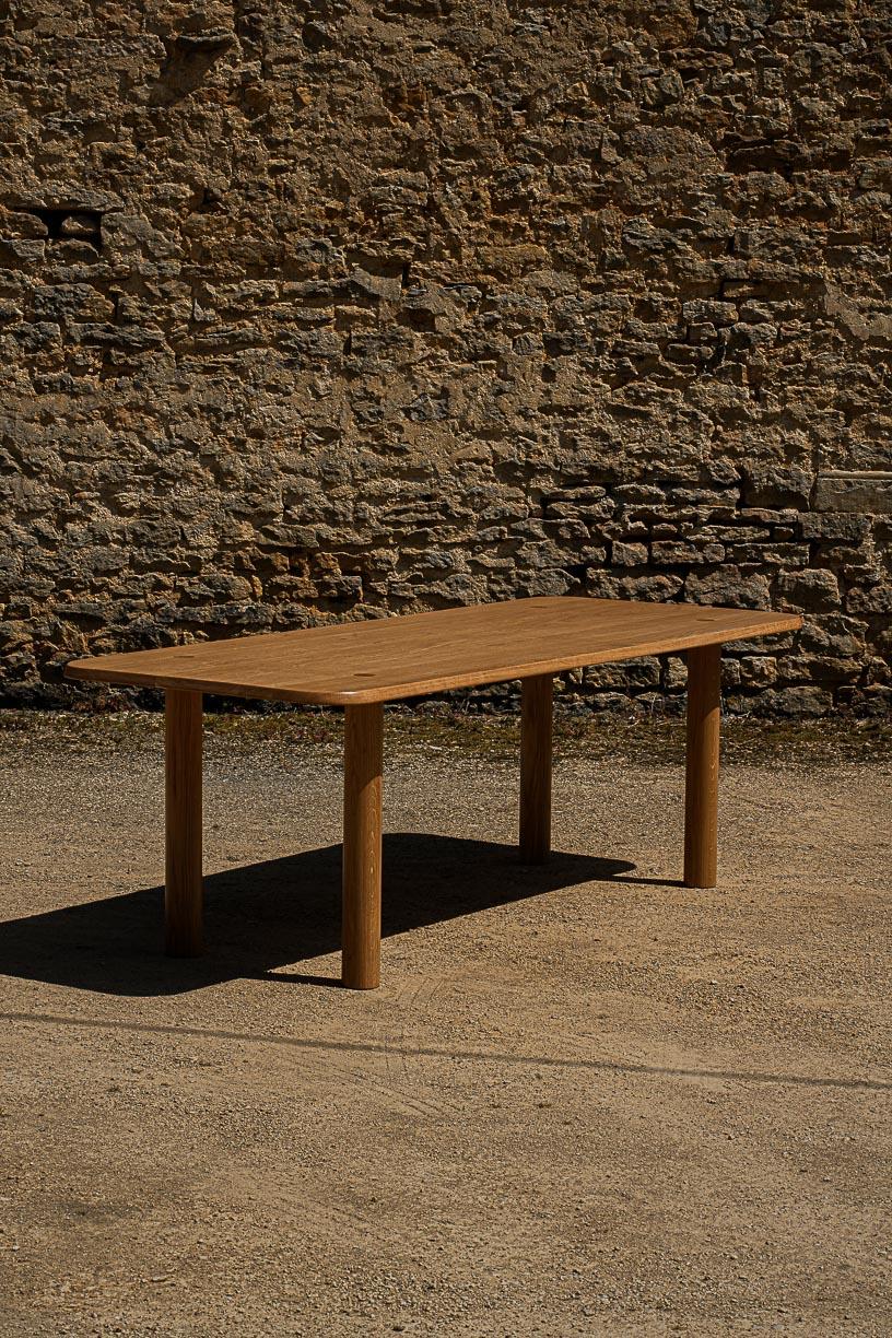 Nayati Dining Table by La Lune
Dimensions: D 95 x W 220 x H 73 cm.
Materials: Solid oak.

Varnished solid oak. Local wood. Produced in France. Custom sizes available.  Also available in a round shape variation. Please contact us.

La Lune is above