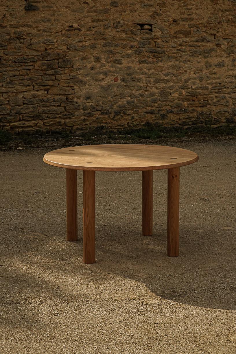 Nayati Round Dining Table by La Lune
Dimensions: Ø 120 x H 74 cm.
Materials: Solid oak.

Varnished solid oak. Local wood. Produced in France. Custom sizes available.  Also available in a square shape variation (D 95 x W 220 x H 73 cm). Please