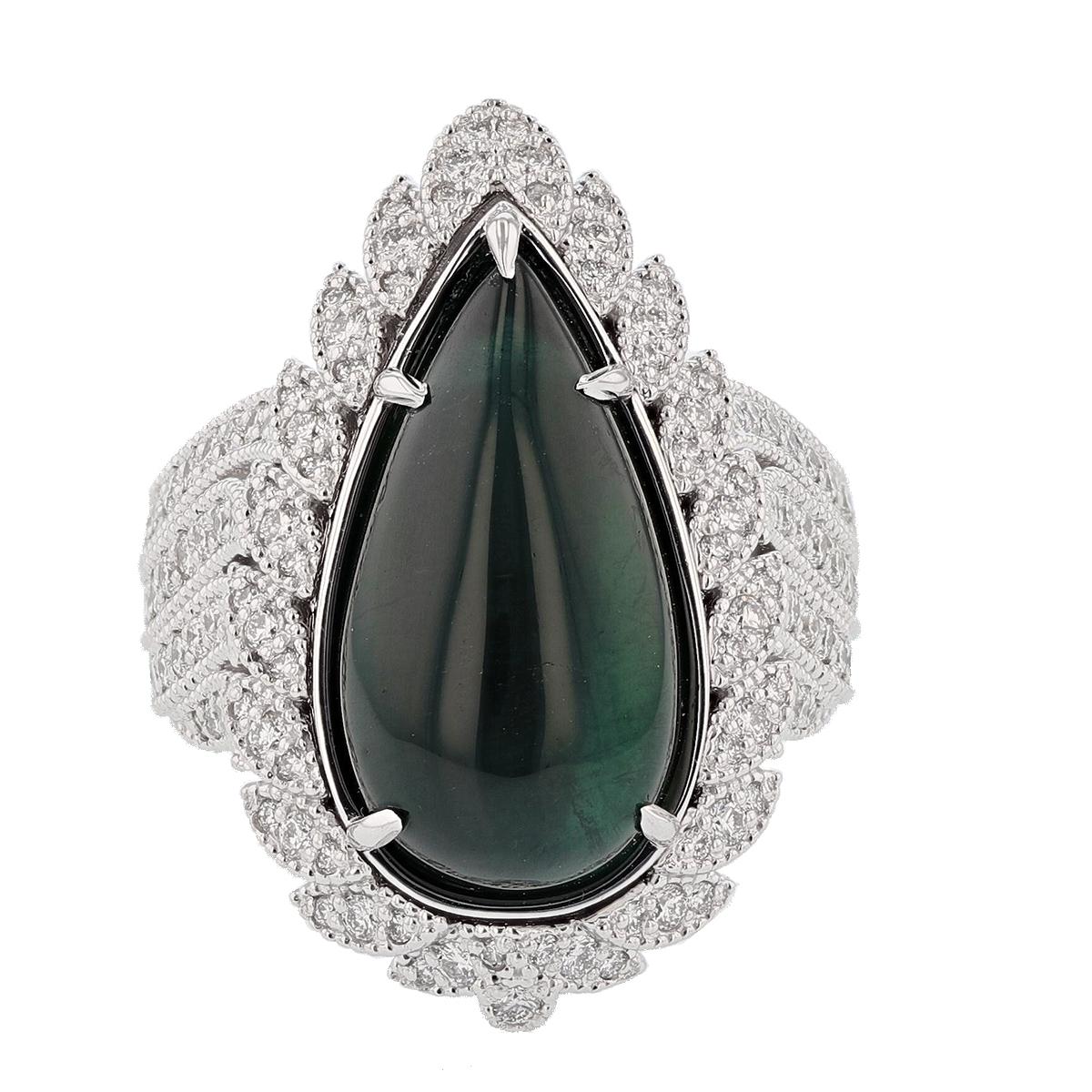 This ring is made in 14k white gold with winged feather inspired design and features an 11.48ct cabochon green tourmaline pear shape, prong set. It also features 142 round cut diamonds weighing 1.29ct prong set color grade (G) clarity grade (VS2).