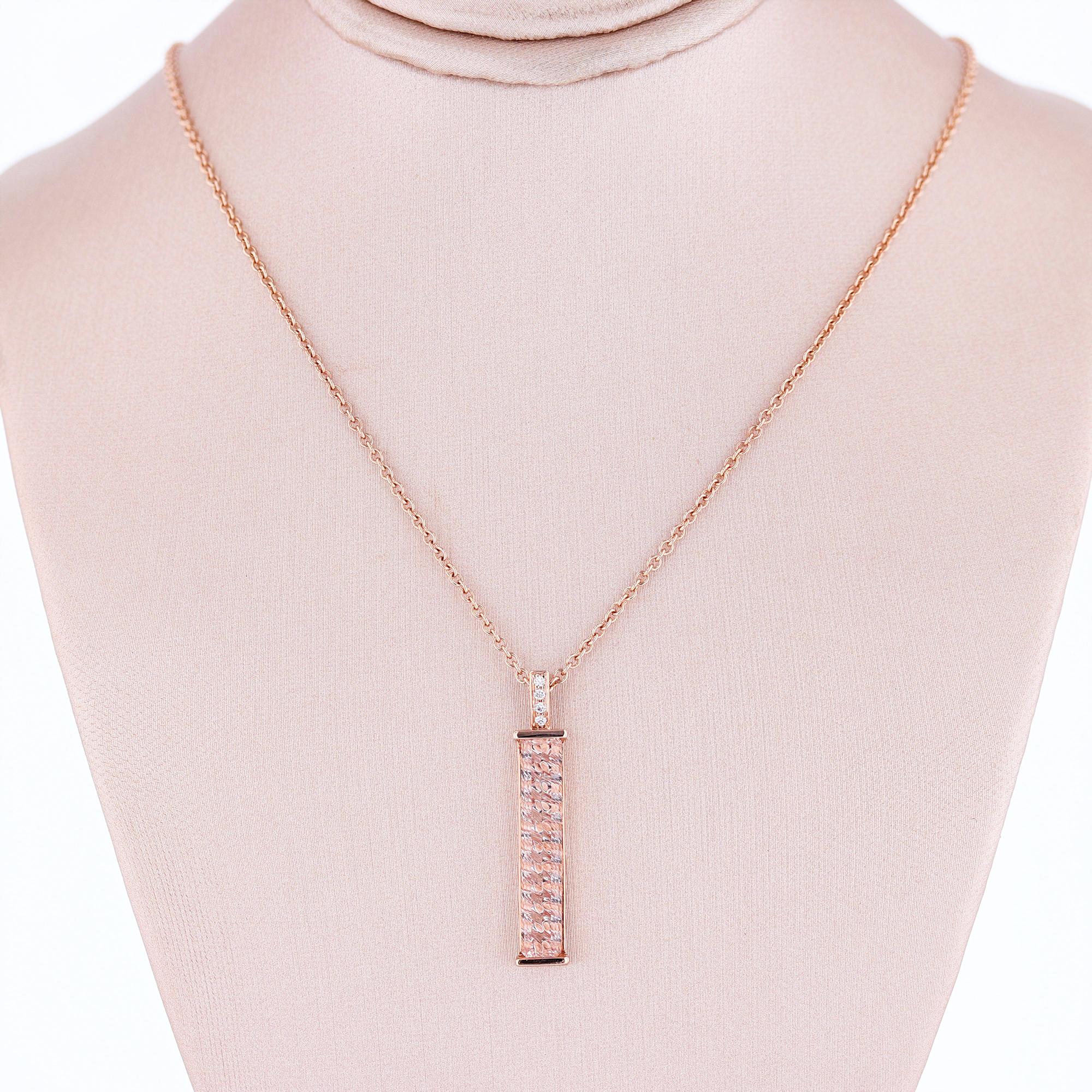 The pendant is made in 14k rose gold gold and features a 3.31ct special cut, rectangular shape green morganite, prong set, and 4 round cut diamonds weighing 0.02ct with a color grade (H) and a clarity grade (SI2), prong set.

The chain is 14k rose