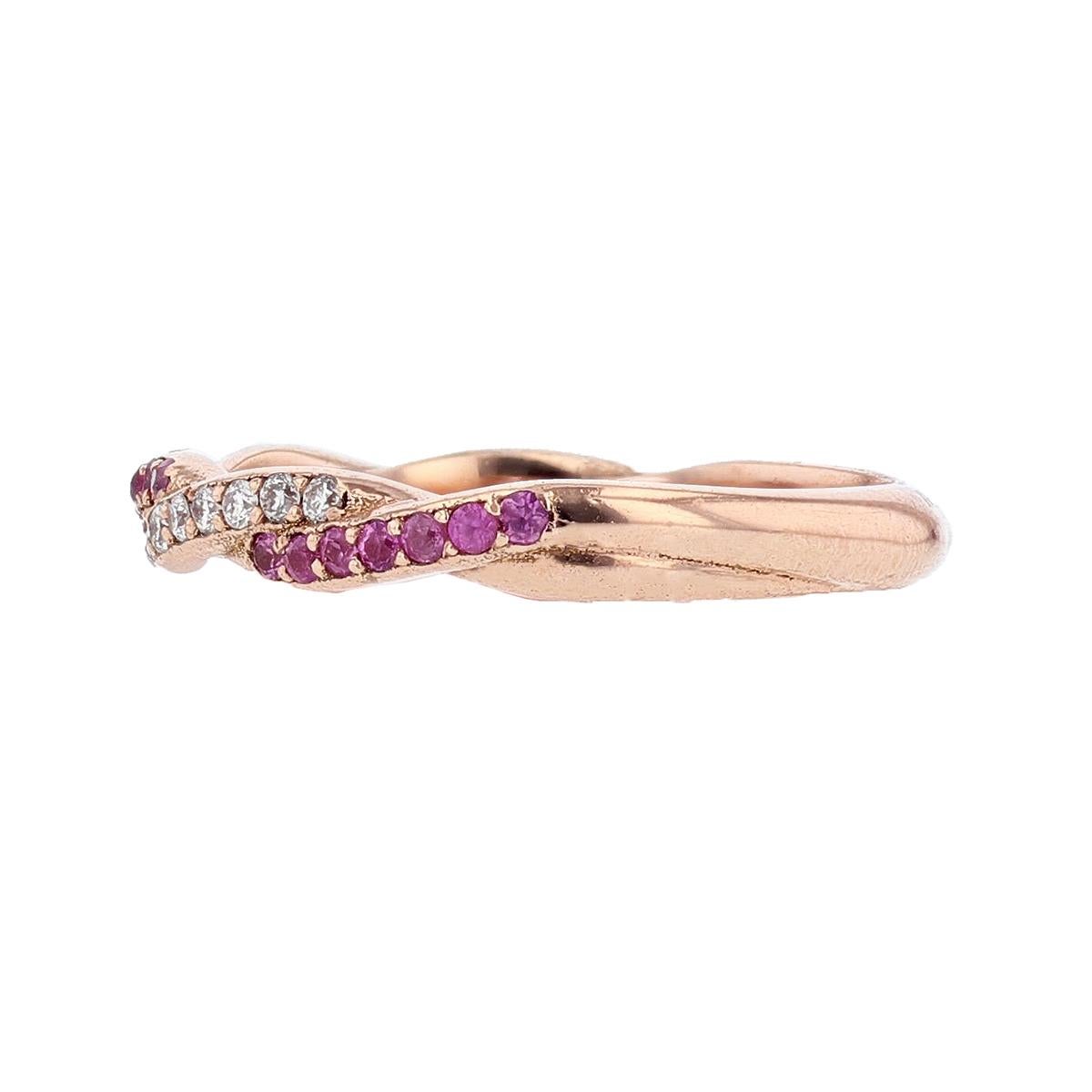 This beautiful twisted band is designed by Nazarelle and made in 14 karat rose gold. The ring features 33 round pink sapphires weighing 0.24ct and 18 round diamonds weighing 0.12ct.