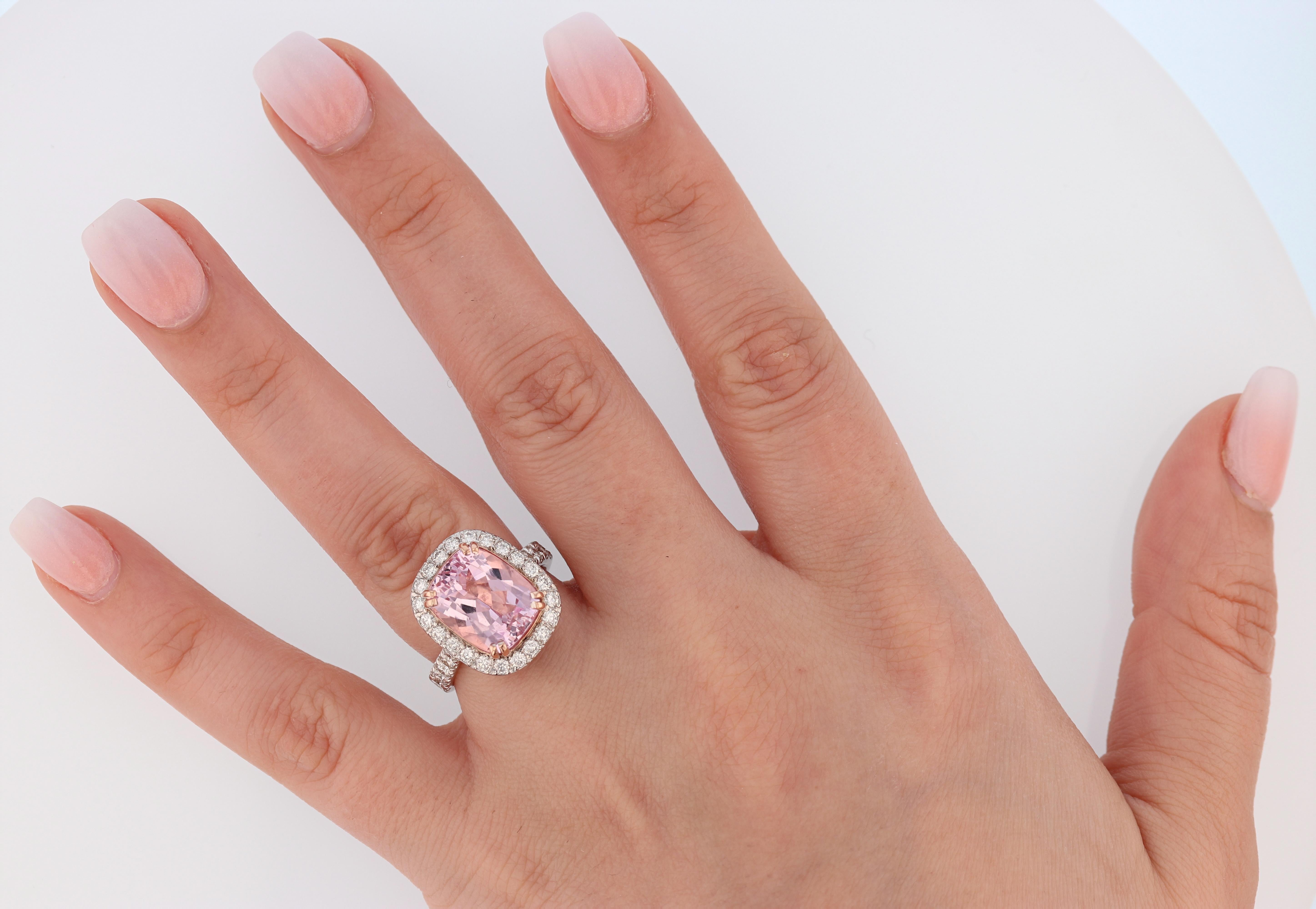 This ring is made in 14K White and Rose gold featuring 1 cushion cut Morganite weighing 5.67 ct. There are 49 round cut diamonds weighing 1.10ct prong set on the ring. This ring features a rose gold basket to give a little more pop of color to it. 