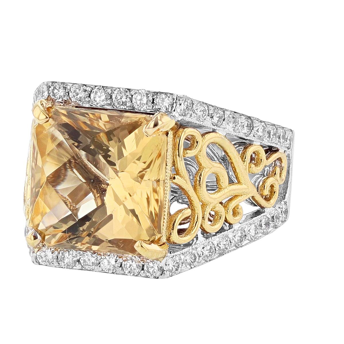 This ring is designed by Nazarelle and made in 14 karat white and yellow gold. The center stone is a princess cut scapolite weighing 5.52 carats and is prong set. The mounting features 48 round cut diamonds weighing 0.82 carats.