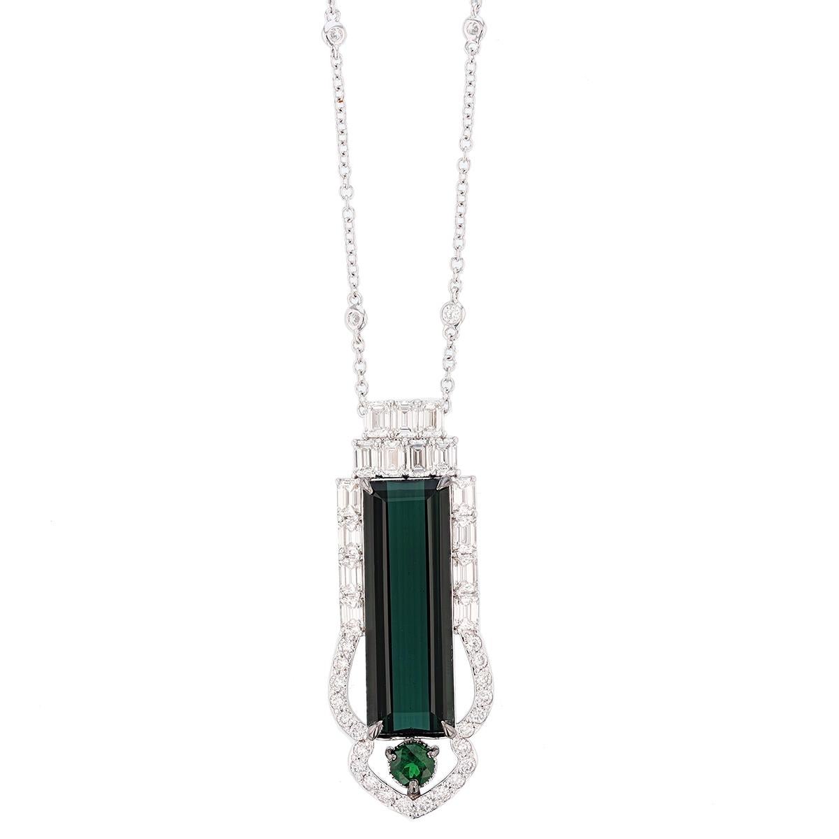 The pendant is made in 14 karat white gold and features a 12.36 carat GIA certified (certification nember: 5171239519) octagonal cut green tourmaline prong set surrounded by 26 round cut diamonds weighing 0.60ctw total weight color grade (G) clarity