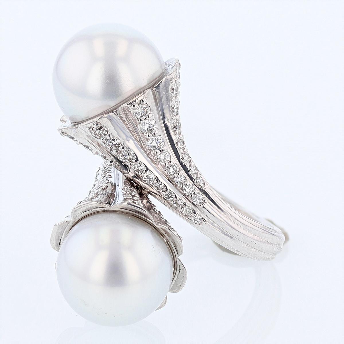 This ring is designed by Nazarelle and made in 14k white gold. The ring features two 12.8mm South Sea Pearls and 76 round diamonds weighing 1.49cts.