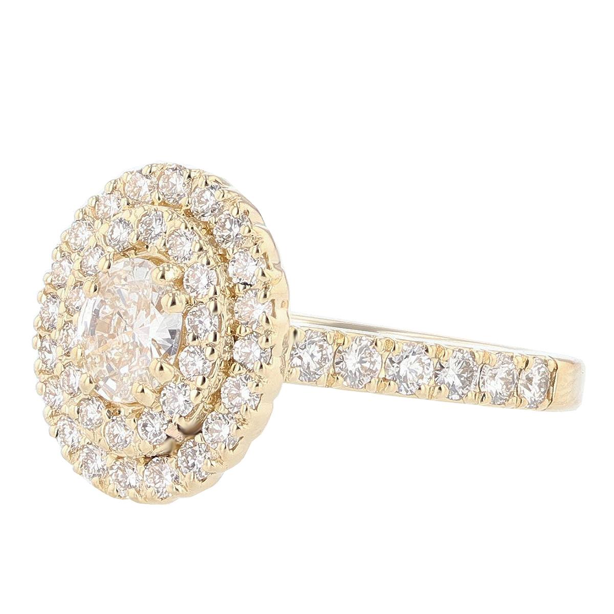 This ring is made with 14 karat yellow gold and features a prong set  0.47ct  IGI certified oval cut diamond (IGI Certificate number: 5813519 ), with a color grade (E) and clarity grade (VS1) and is surrounded by 49 round cut diamonds weighing