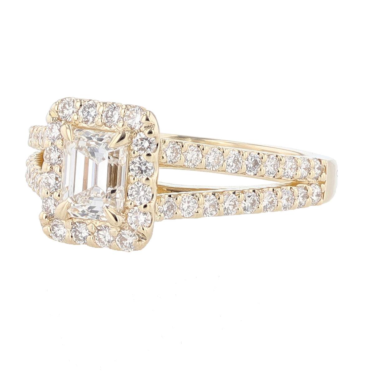 This ring is made with 14 karat yellow gold and features a 0.80ct  IGI certified Emerald Cut Diamond (IGI Certificate number: 9273112) with a color grade (F) and clarity (VVS2) and is surrounded by 54 round cut diamonds weighing 0.71ct with a color