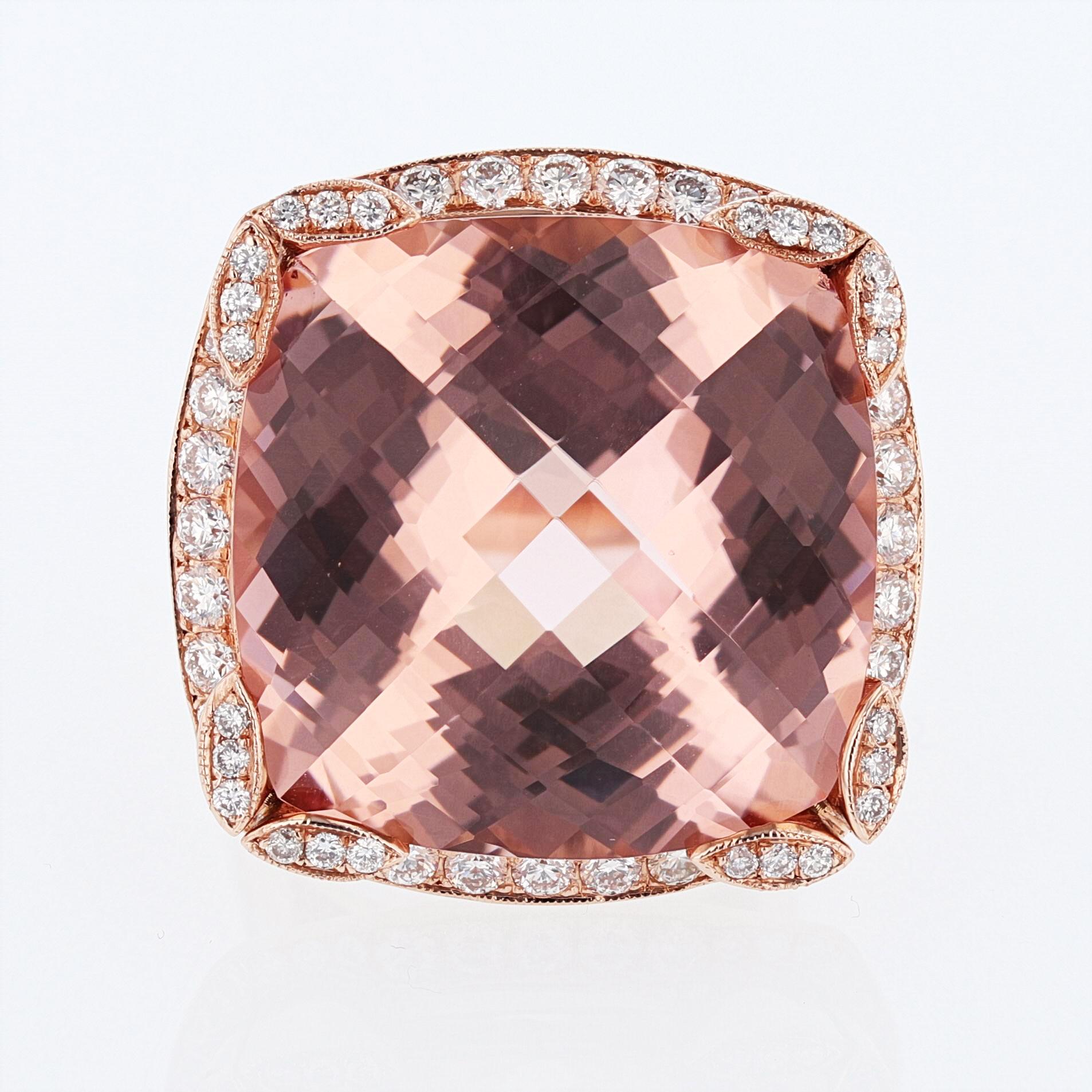 This ring is made in 14k rose gold and features a 41.10ct cushion cut checkerboard morganite prong set for the center stone and features 108 pave set round cut diamonds weighing 2.00ct total color grade (H) clarity grade (SI1) designed by Nazarelle