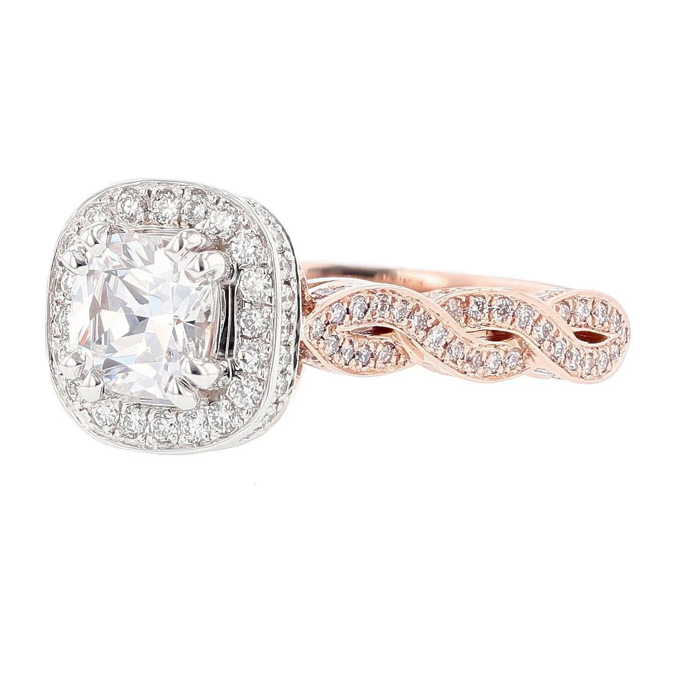 This ring is made in 14k white and rose gold and features a 1.00ct cushion cut diamond GIA certified color grade (F) clarity grade (SI2). The GIA certifcate is 