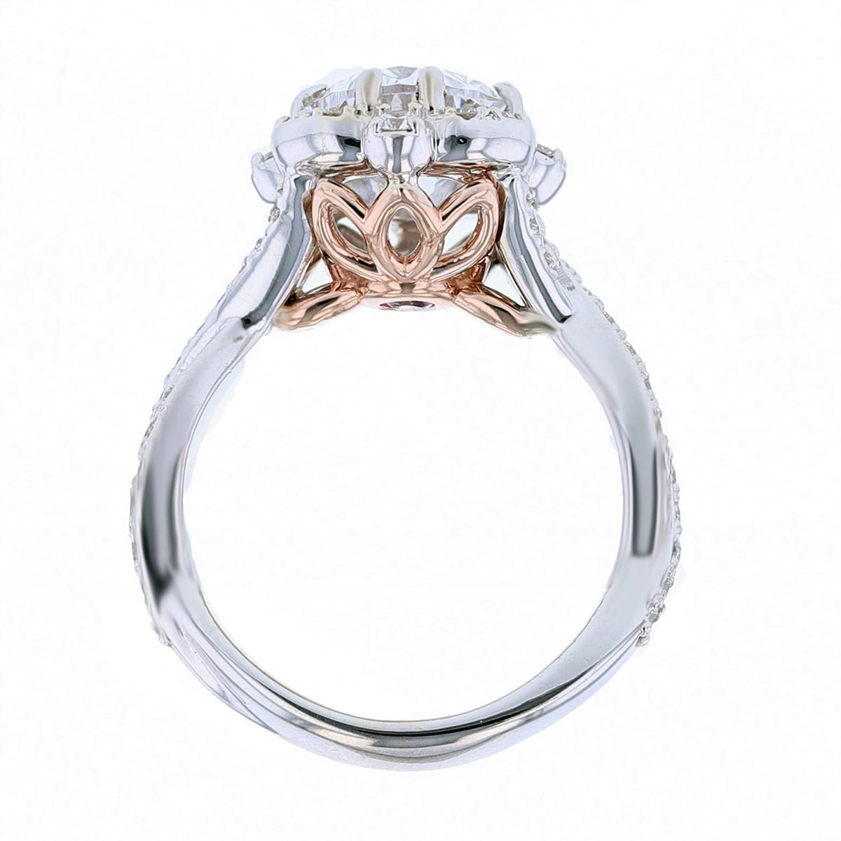 This ring is made in 14k white and rose gold and features a 2.02ct oval shape diamond color grade (G) clarity grade (VS1) Gia certified. The certificate number is 