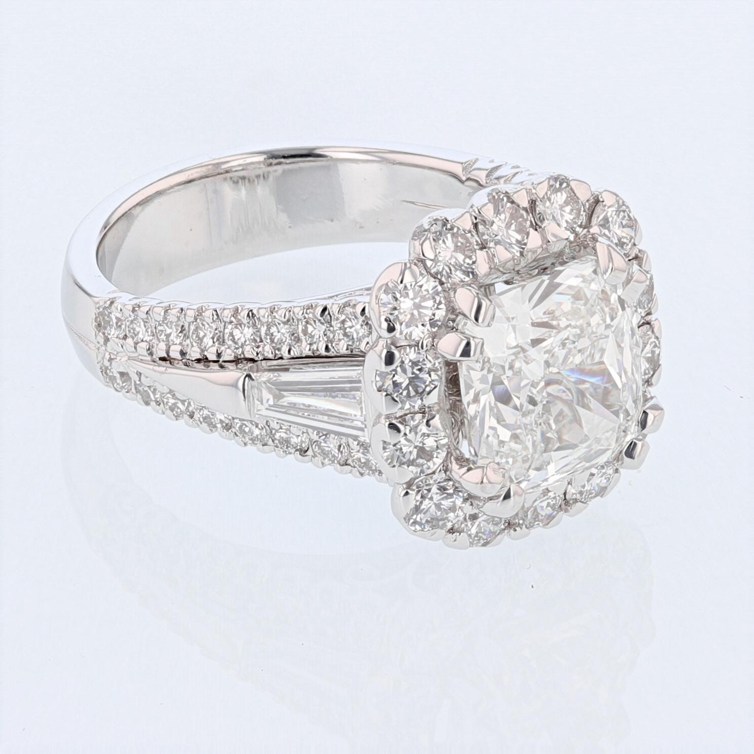This ring is made in 14K white gold featuring a 3.66ct GIA certified cushion cut diamond weighing 3.66ct. color grade (J) clarity grade (VS1). Certificate number is GIA 210537647. The ring features 49 round cut diamonds weighing 1.67ct color grade