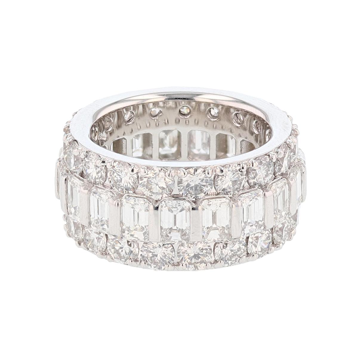 The ring is made in 14K White Gold and features 19 Emerald cut Diamonds, channel set weighing 4.46cts and 38 Round cut Diamonds, prong set weighing 5.08cts with a color grade (H-I) and clarity grade (VS/SI). 