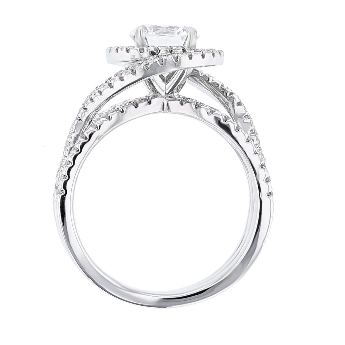 This ring is made in 14k white gold and features a 1.01ct round cut diamond GIA certified color grade (G) clarity grade (SI1). The certificate number is 