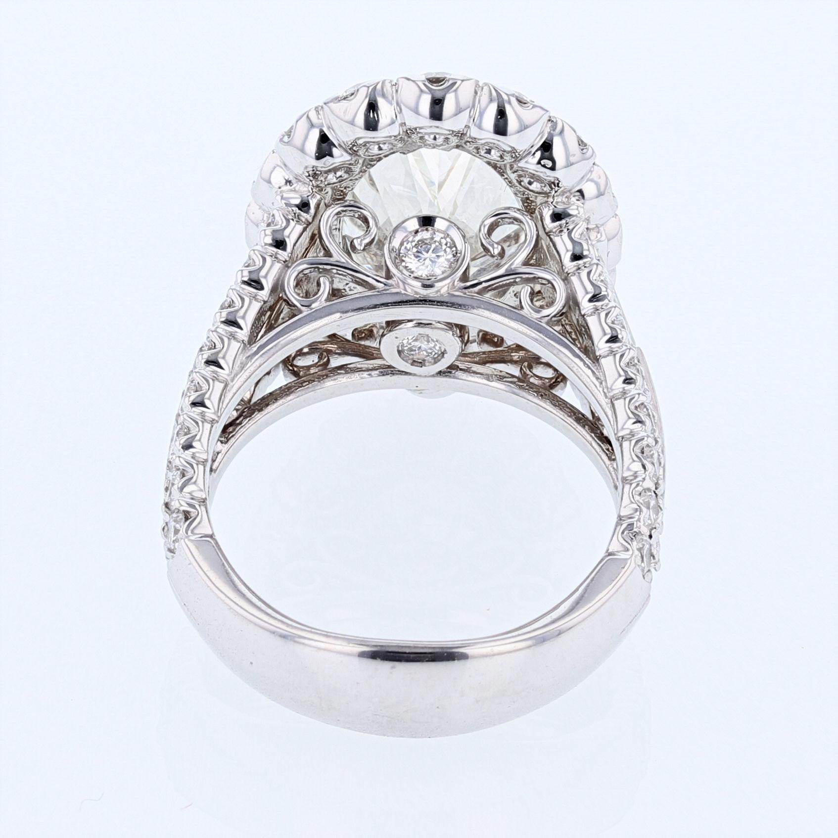 Contemporary Nazarelle 14 Karat Gold GIA 6.07 Carat Oval Cut Diamond Halo Split Shank Ring For Sale
