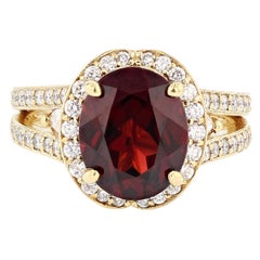 Nazarelle 18 Karat Yellow Gold 4.43 Carat Oval Garnet and Diamond Ring
