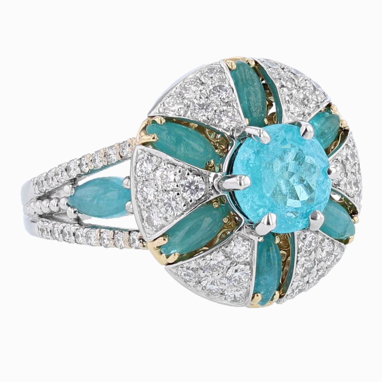 This ring is designed by Nazarelle and is made in 18K white and yellow gold. The center stone is a GIA certified Brazilian Paraiba Tourmaline weighing 1.41ct. The certificate number is GIA 5201167890. The mounting features 8 cabochon marquise shape