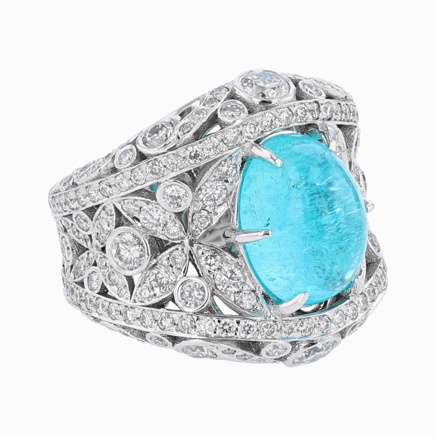 This ring is designed by Nazarelle and is made in 18k white gold. The center stone is a Brazilian 5.27ct GIA certified Paraiba Tourmaline oval cabochon. The certificate number is GIA 1172211578. The mounting features 218 round cut diamonds pave set