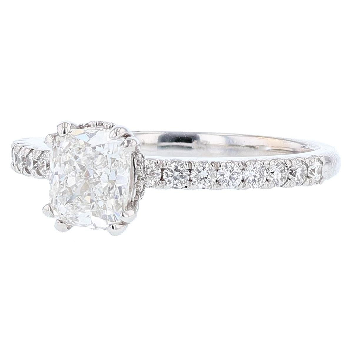 This ring is made in platinum and 18K white gold. The center diamond is a 1.02ct GIA certified cushion cut diamond with a color grade (F) and clarity grade (IF) clarity. The certificate number is 
