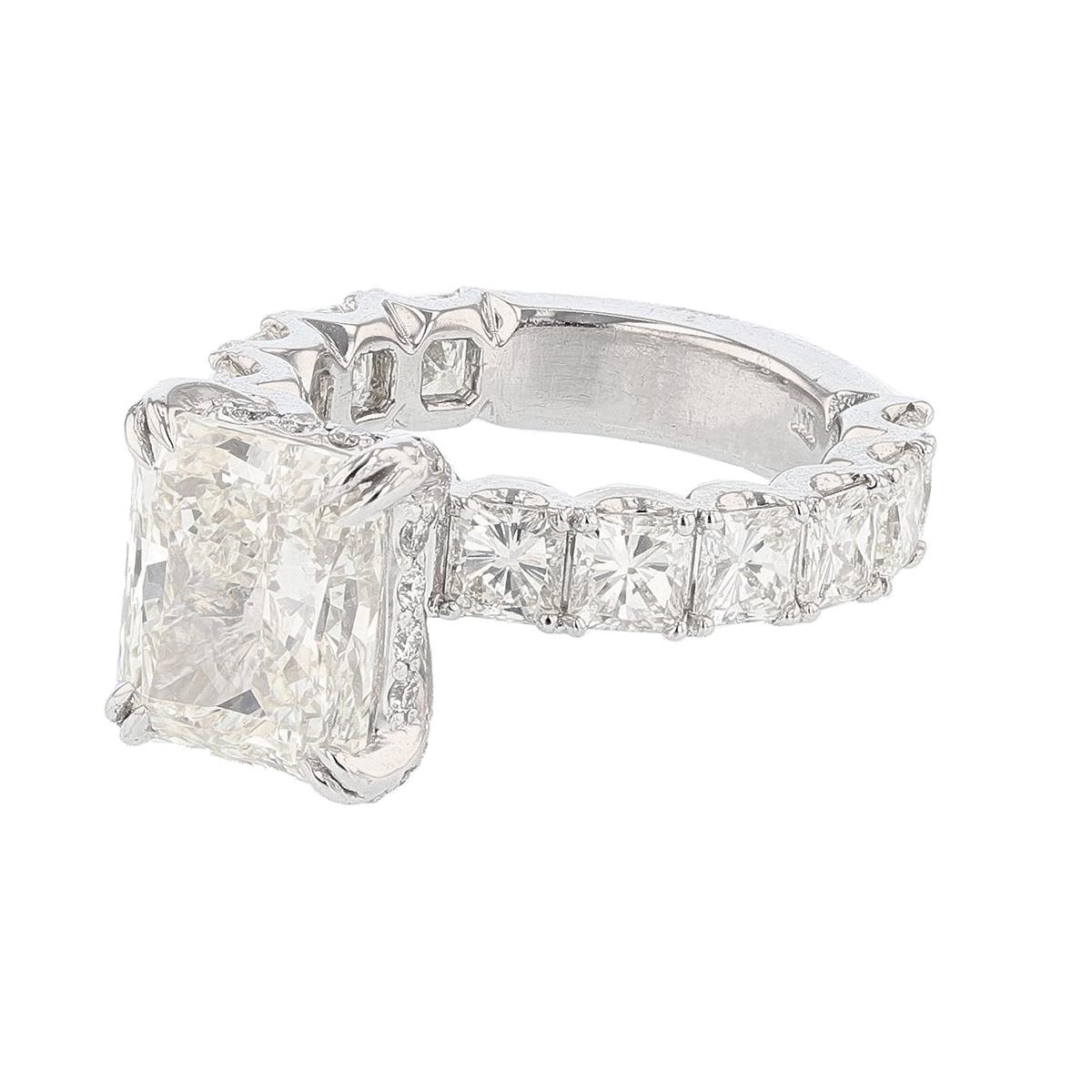 This ring is made in platinum and 14K  white gold diamond ring. The center diamond is a 5.13ct GIA certified radiant cut diamond with a color grade (K) and clarity grade (VS2) clarity. The certificate number is 