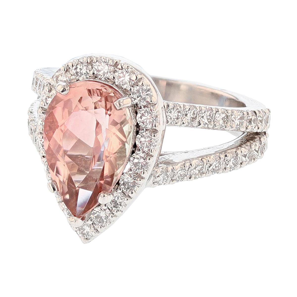 This ring is made in platinum featuring a pear shaped Pink Tourmaline weighing 3.22CT that is prong set.  The ring also features 50 round cut, prong set diamonds weighing 1.21cts with a color grade (G) and clarity grade (VS1/VS2). 