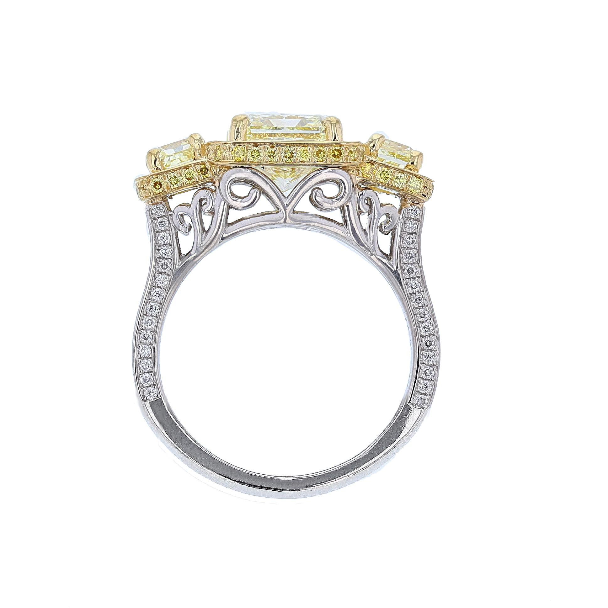 This ring is made in platinum and 18K yellow gold with yellow and white diamonds. The center diamond is a 3.02ct Gia certified Fancy Light Yellow radiant cut diamond and is (VS2) clarity. The certificate number is 