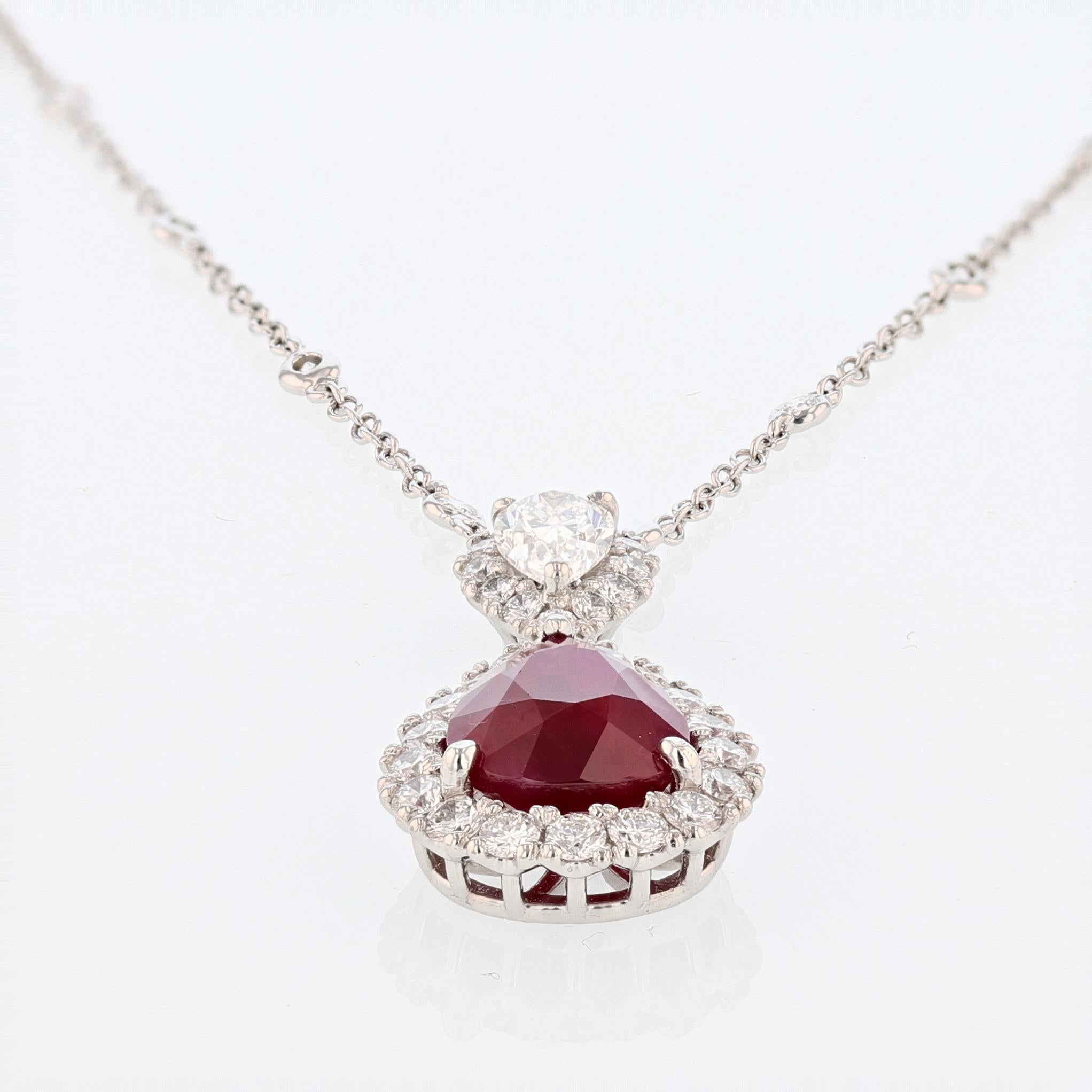 This pendant is made in platinum featuring one pear shape GRS certified Burmese Ruby weighing 6.21ct. The certificate number is GRS2013-022291. There is one 0.70ct pear shape diamond set on the bail with EGL certificate color grade (D) clarity grade