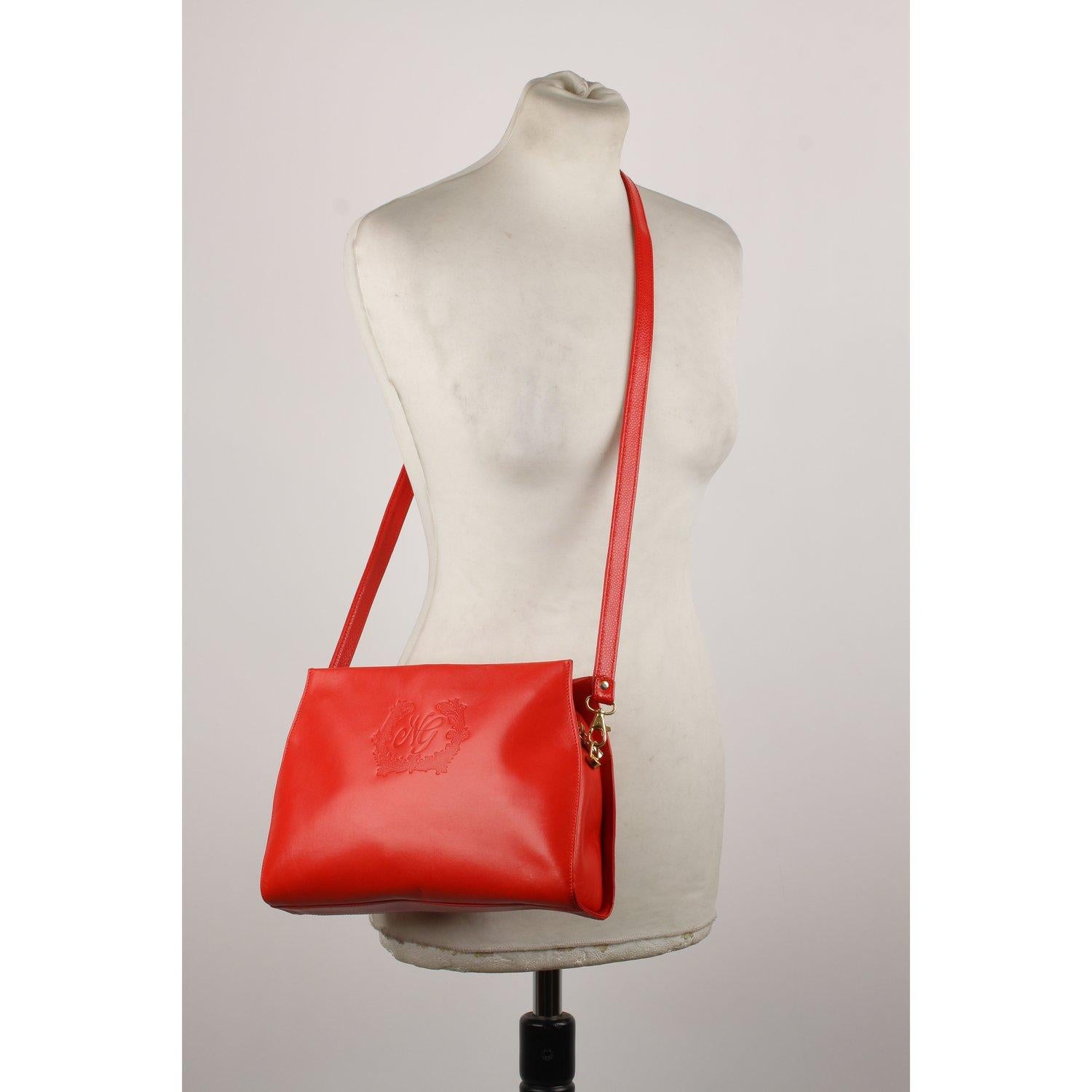 MATERIAL: Leather COLOR: Red MODEL: Shoulder Bag GENDER: Women SIZE: Small Condition CONDITION DETAILS: B :GOOD CONDITION - Some light wear of use - Some scratches on leather due to normal use. Some darkness on bottom corners, Measurements