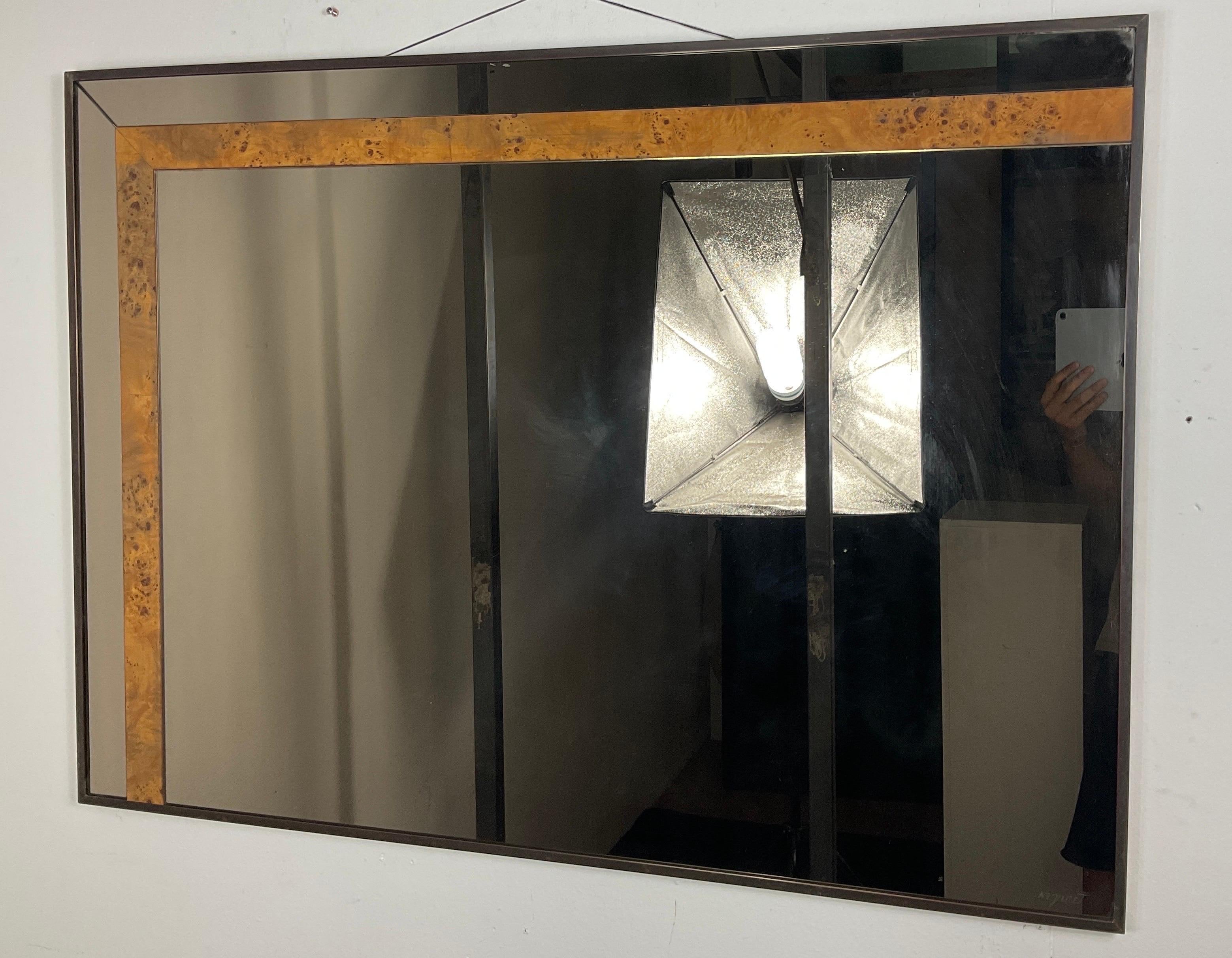 Nazareth mirror from the 70s with brass frame, wood above the mirror frame. In good condition with small wear and tear caused by use and the passing of years