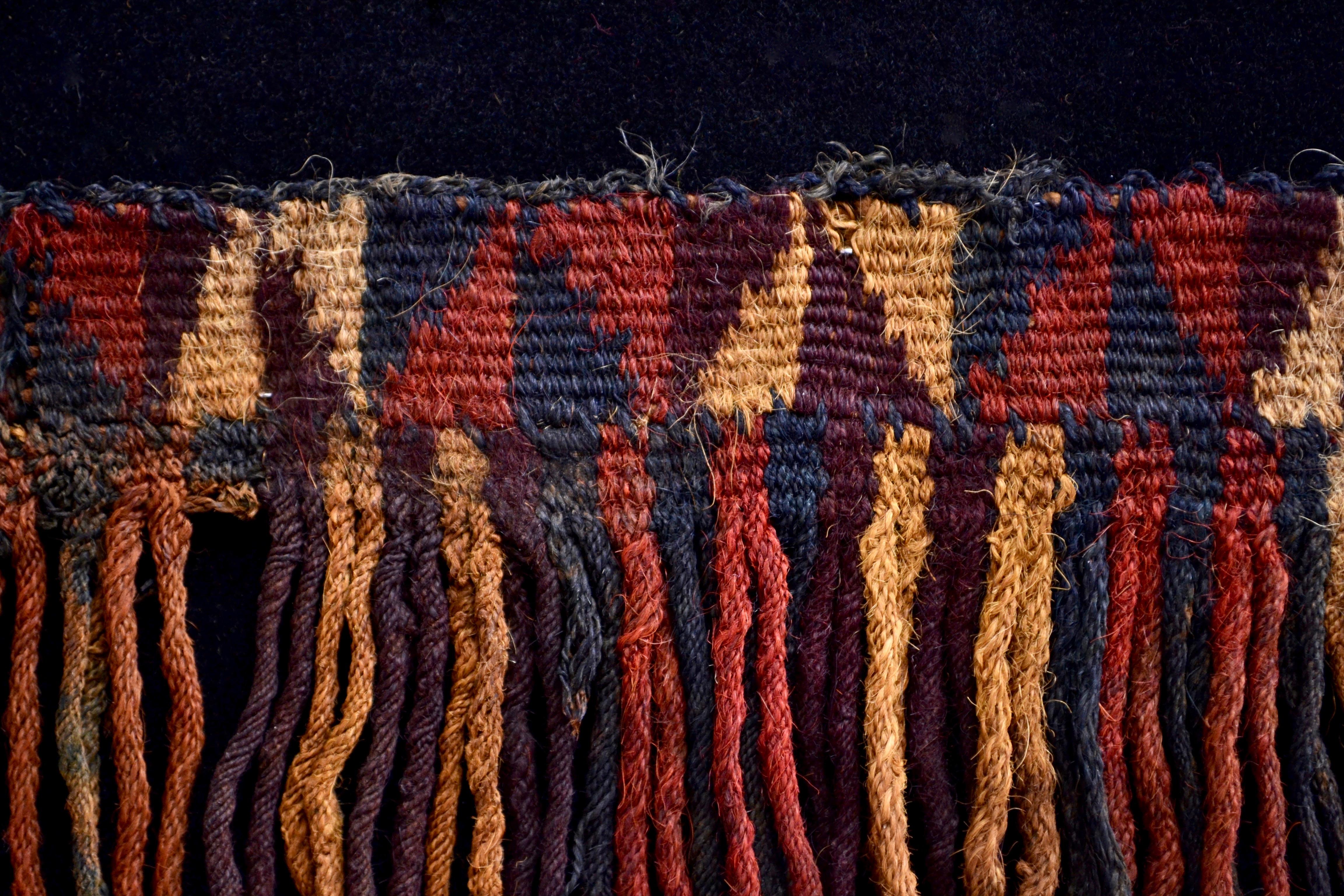 Rare and colorful fringed pre-Columbian textile fragment. This piece is framed in a black shadowbox.

It is a wonder to behold antiquities such as a pre-columbian textiles, an authentic piece of art that has been preserved for centuries and that