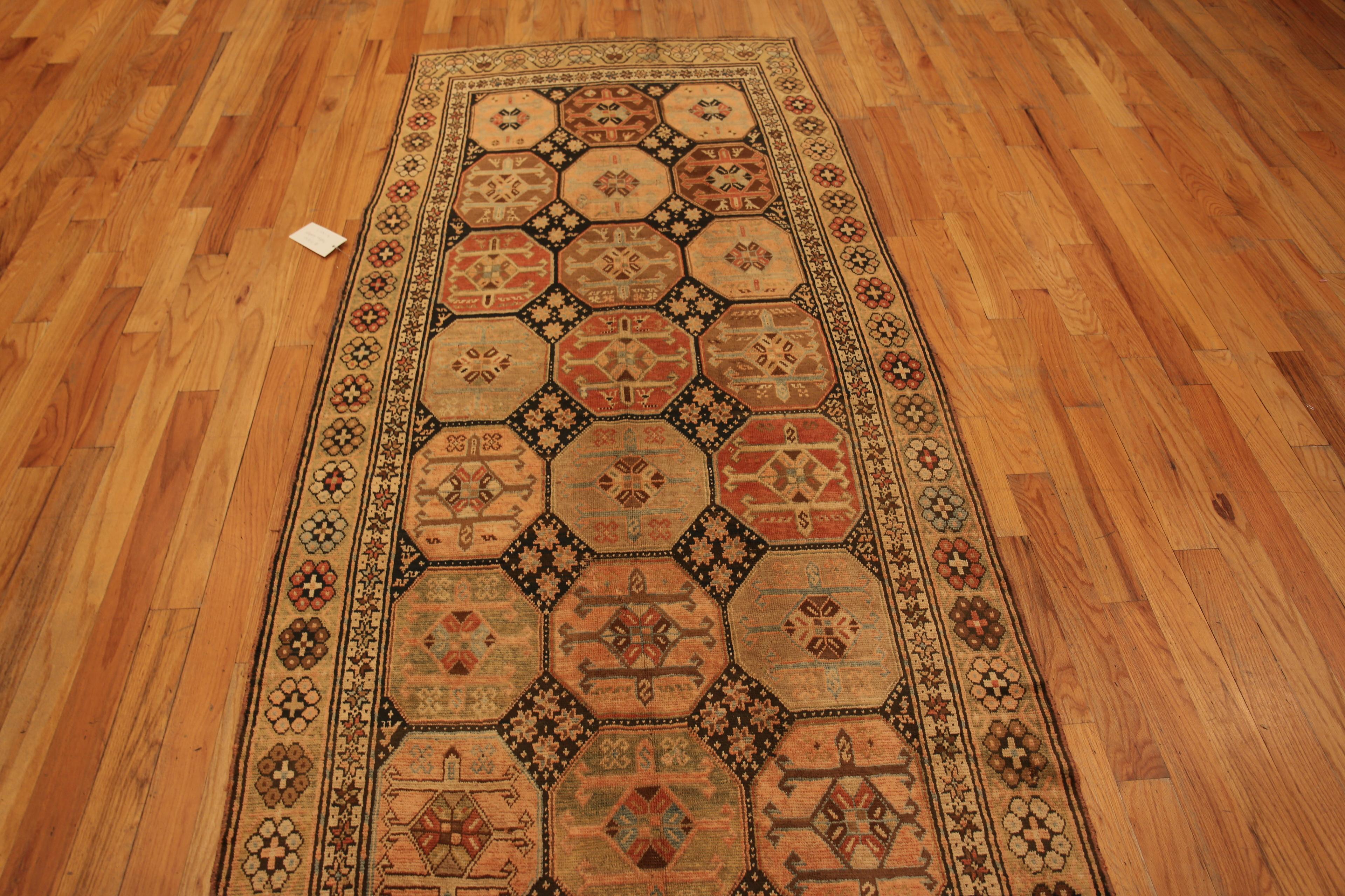 Nazmiyal Collection Antique Caucasian Karabagh Runner Rug, Country Of Origin: Caucasus, Circa date: 1900. Size: 4 ft 1 in x 11 ft 7 in (1.24 m x 3.53 m)