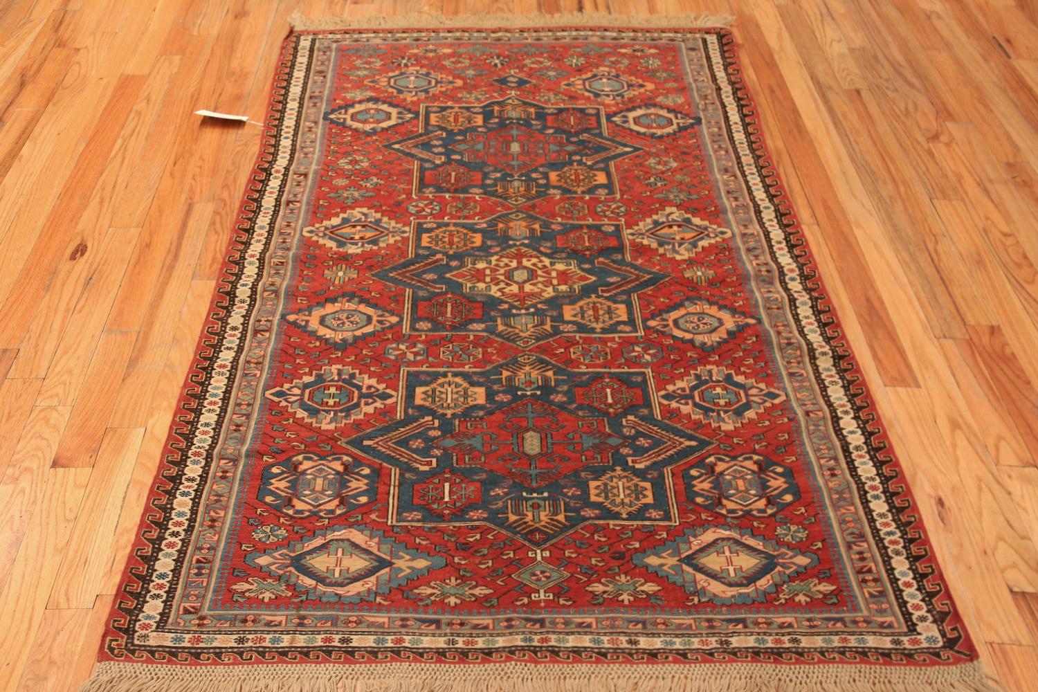 Rustic Red Beautiful Antique Caucasian Soumak Rug, Country of Origin: Caucasus, Circa Date: 1900 – The antique tribal Caucasus rugs have a unique style that makes them stand out among other antique rugs of the region. Their ancient symbols and